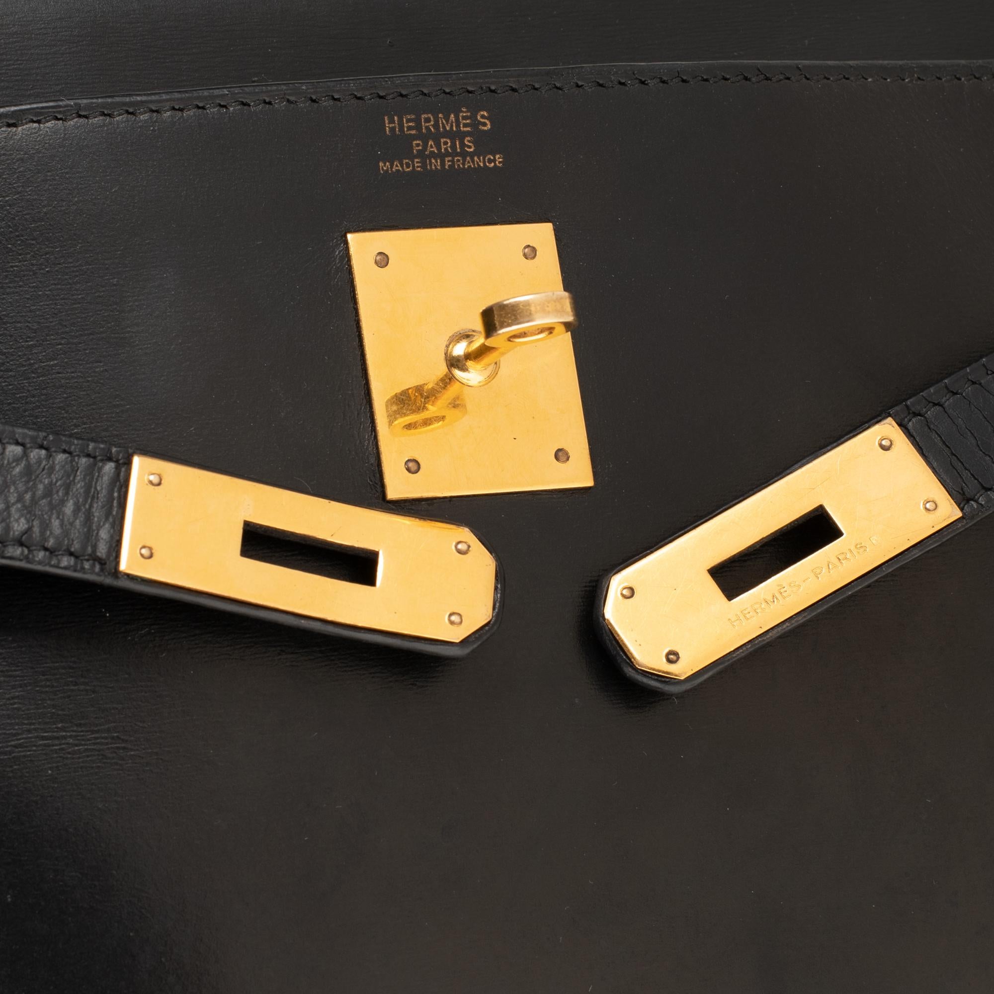 Women's Hermès Kelly 32 cm strap shoulder bag in black calfskin box and gold hardware