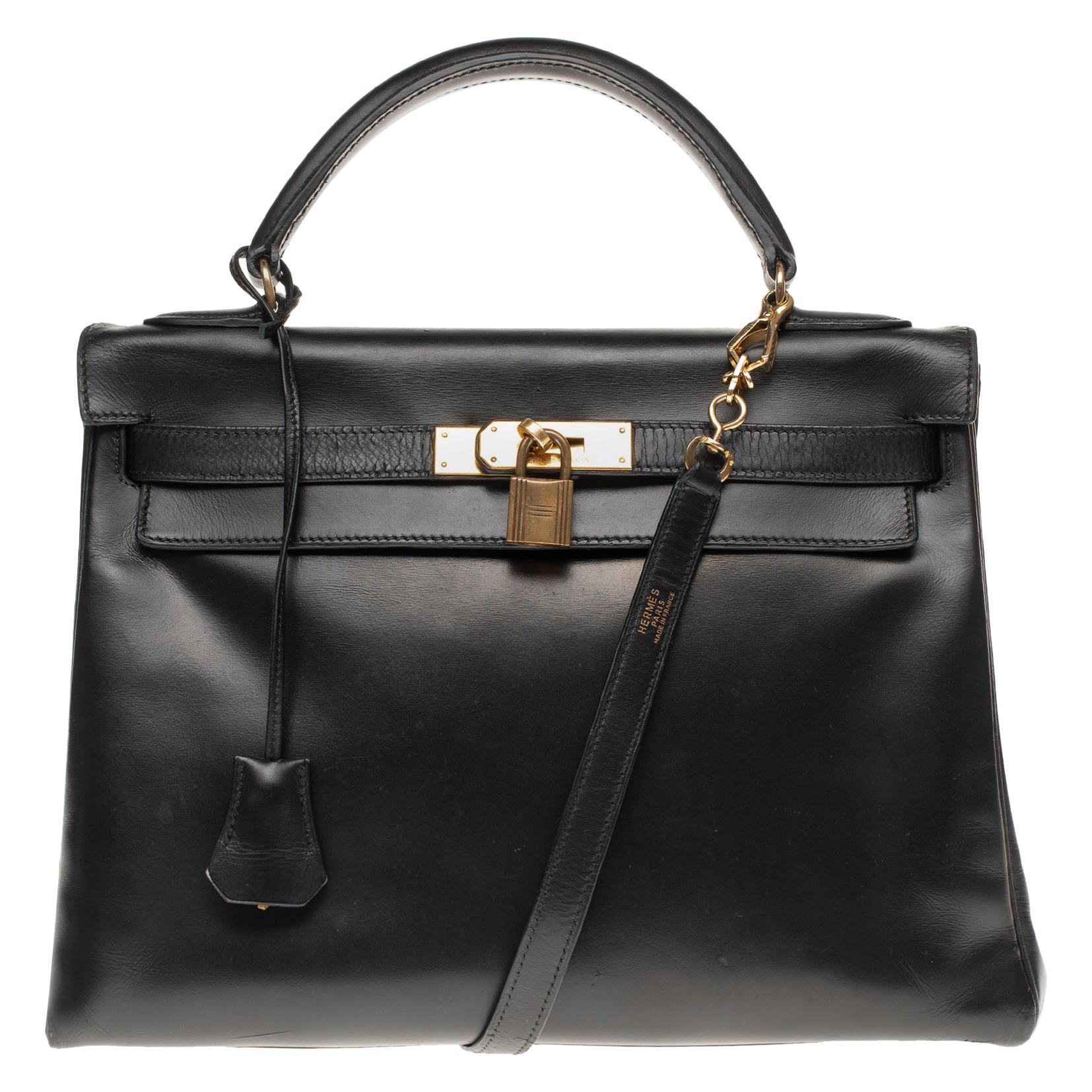 Hermès Kelly 32 cm strap shoulder bag in black calfskin box and gold hardware