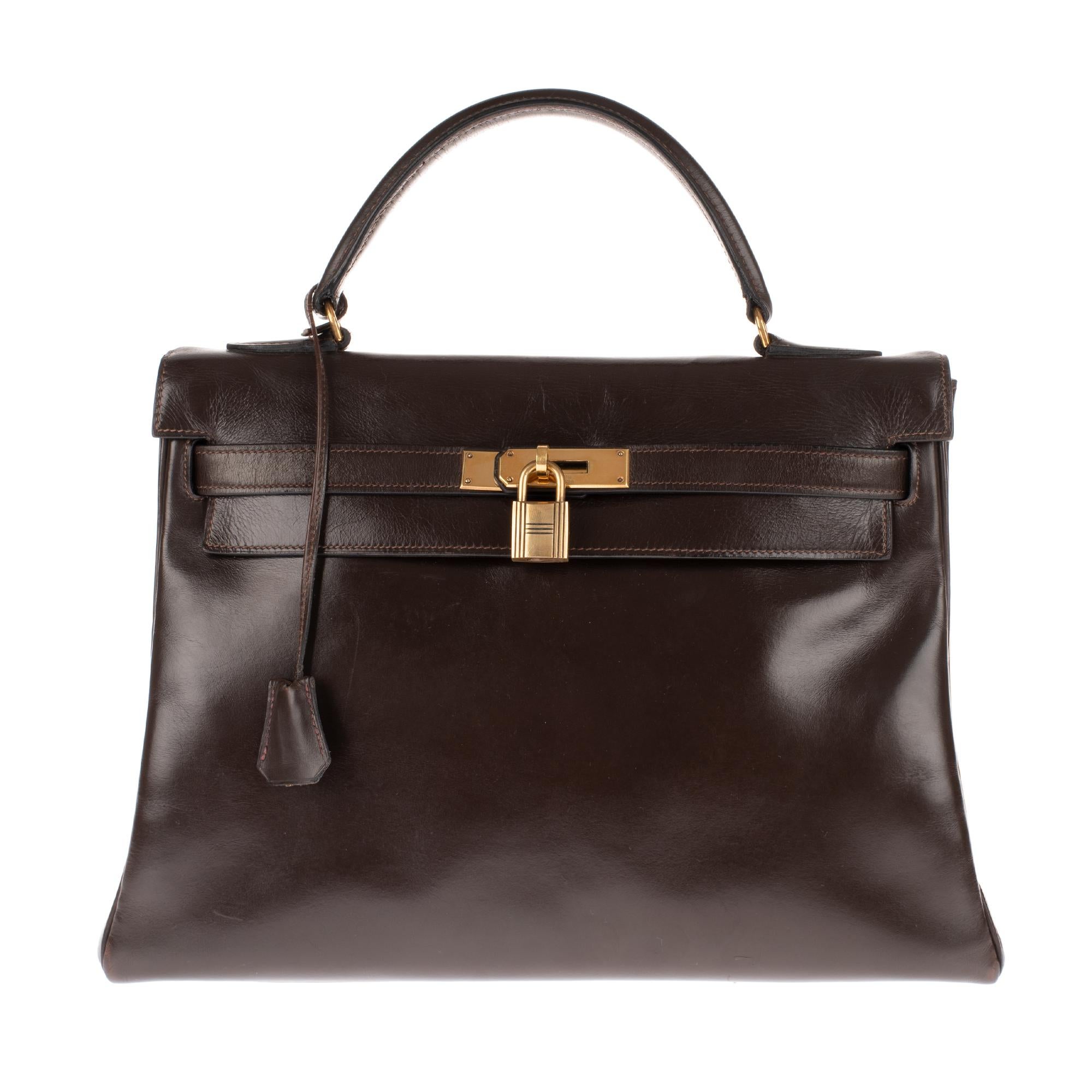 Black Hermès Kelly 32 handbag in brown calfskin leather with strap and golden hardware