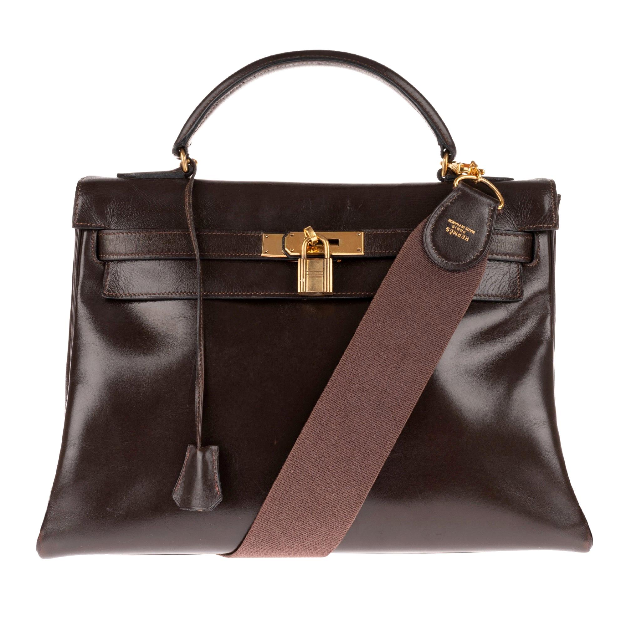 Hermès Kelly 32 handbag in brown calfskin leather with strap and golden hardware