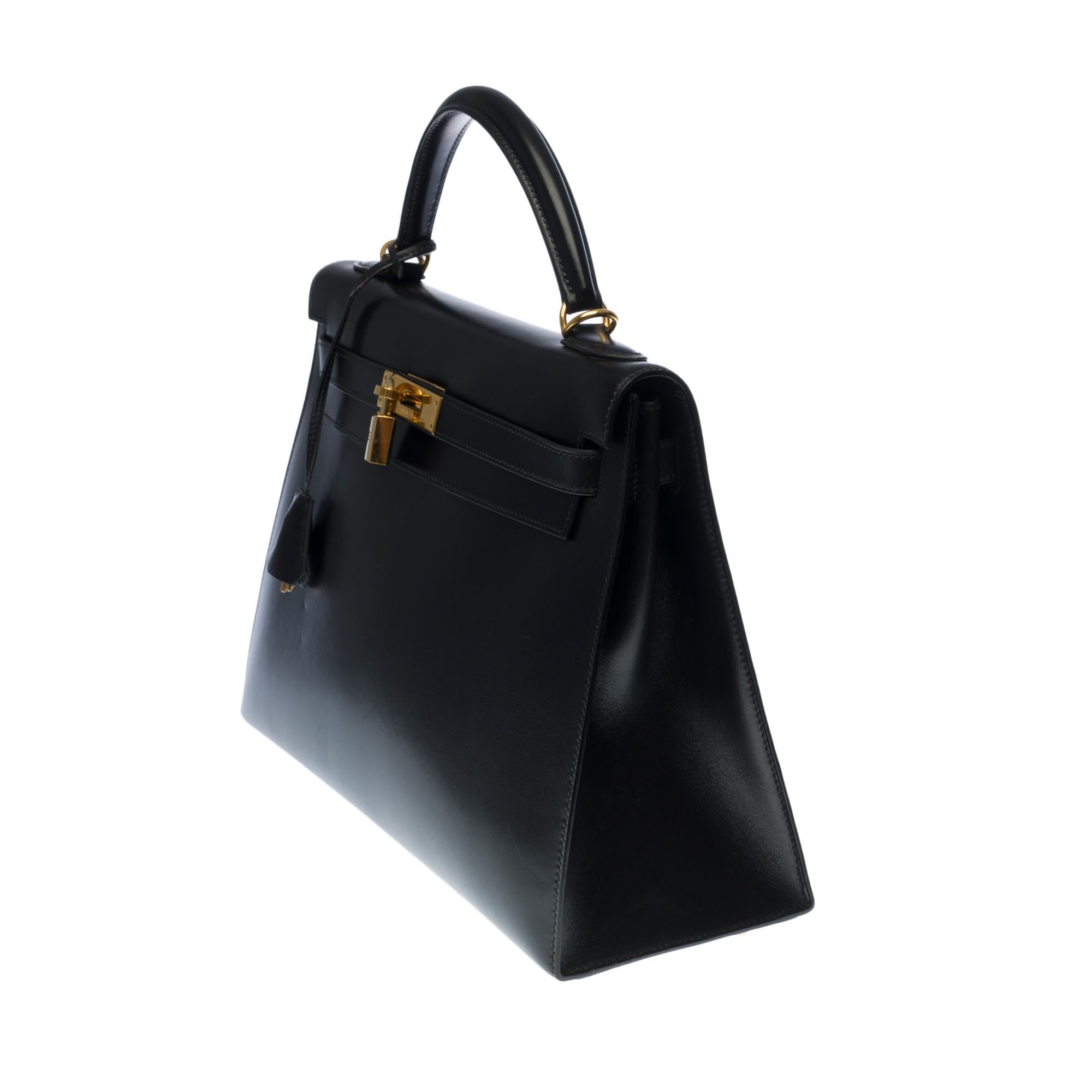 Black Hermès Kelly 32 handbag with strap in black box calfskin leather, GHW