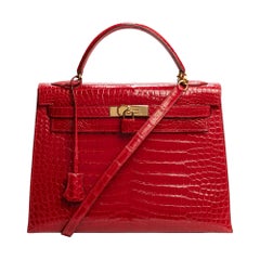 Hermès Kelly 32 Handtasche mit Riemen aus Krokodil "rouge braise":: goldene Beschläge
