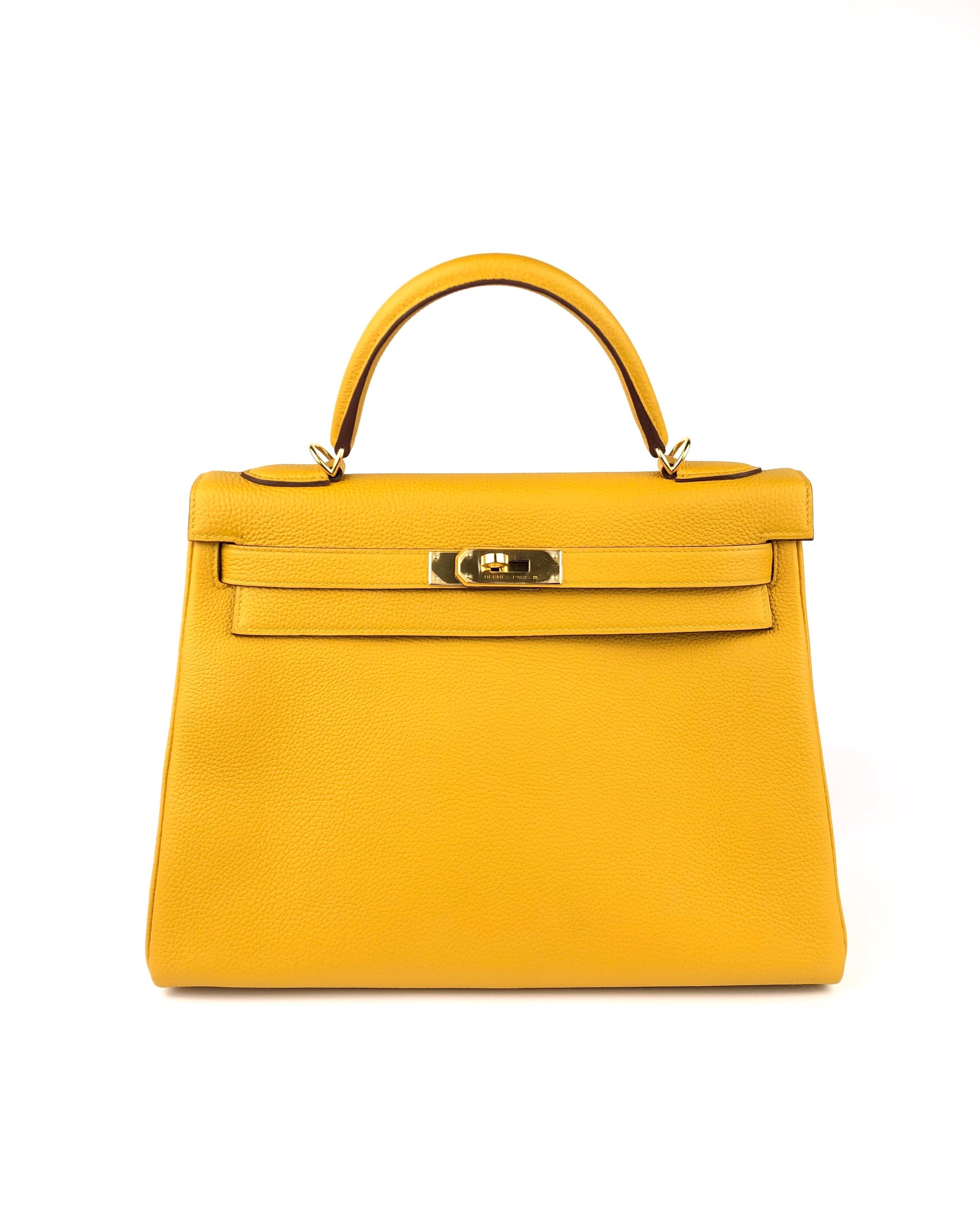 Hermes Kelly 32 Jaune Ambre Yellow Togo Gold Hardware. MINT CONDITION WITH ALL PLASTIC EXCEPT ON ONE FOOT 98% LIKE NEW! C STAMP 2018!
*MISSING LEATHER CLOCHETTE*

Shop with confidence from Lux Addicts. Authenticity guaranteed or money back.