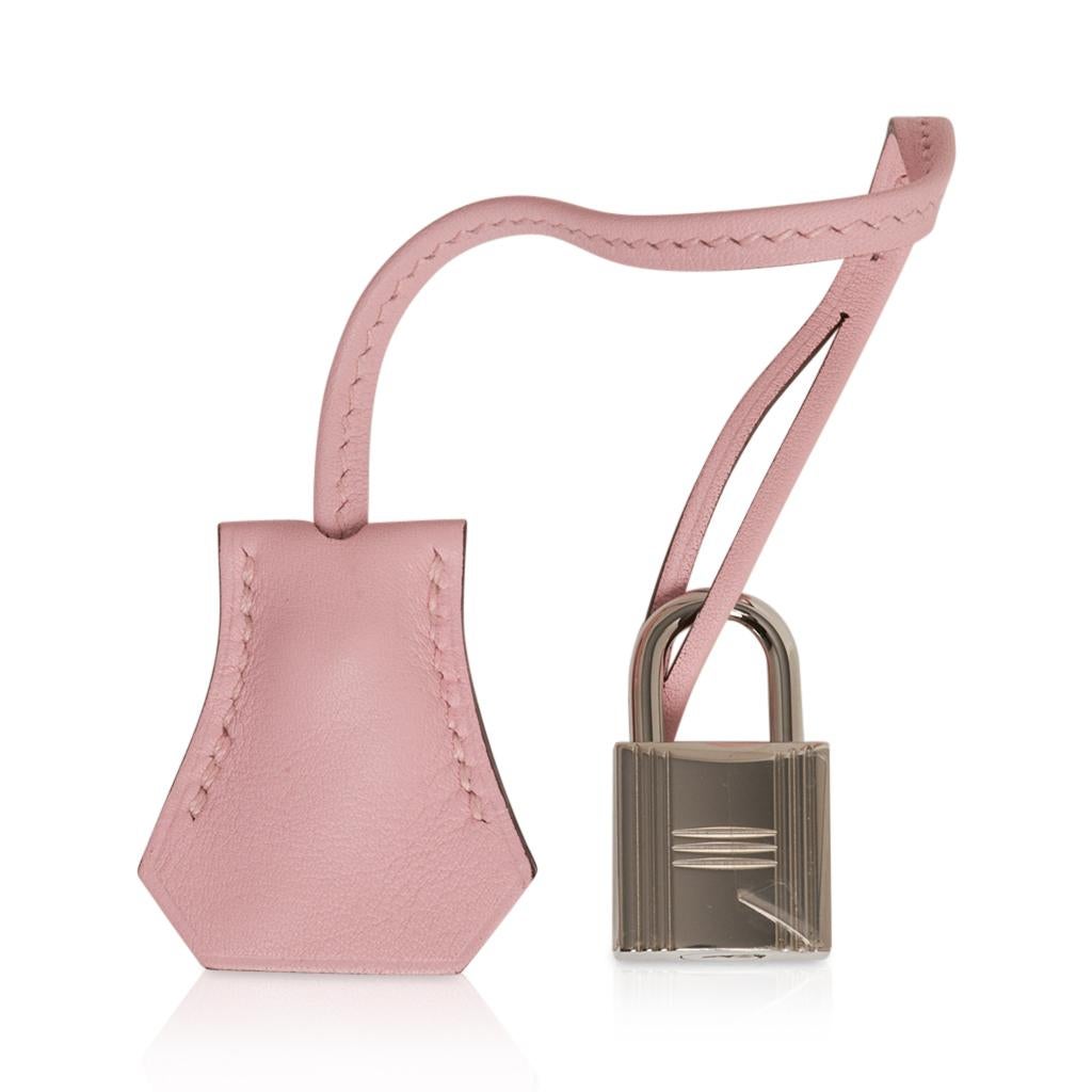 Guaranteed authentic limited edition Hermes 32 Kelly Lakis bag featured in rare Rose Sakura.
Signature front and zipper pockets.
Swift leather with Palladium hardware.  
This beauty is sure to become your ultimate go to bag!
Comes with strap,