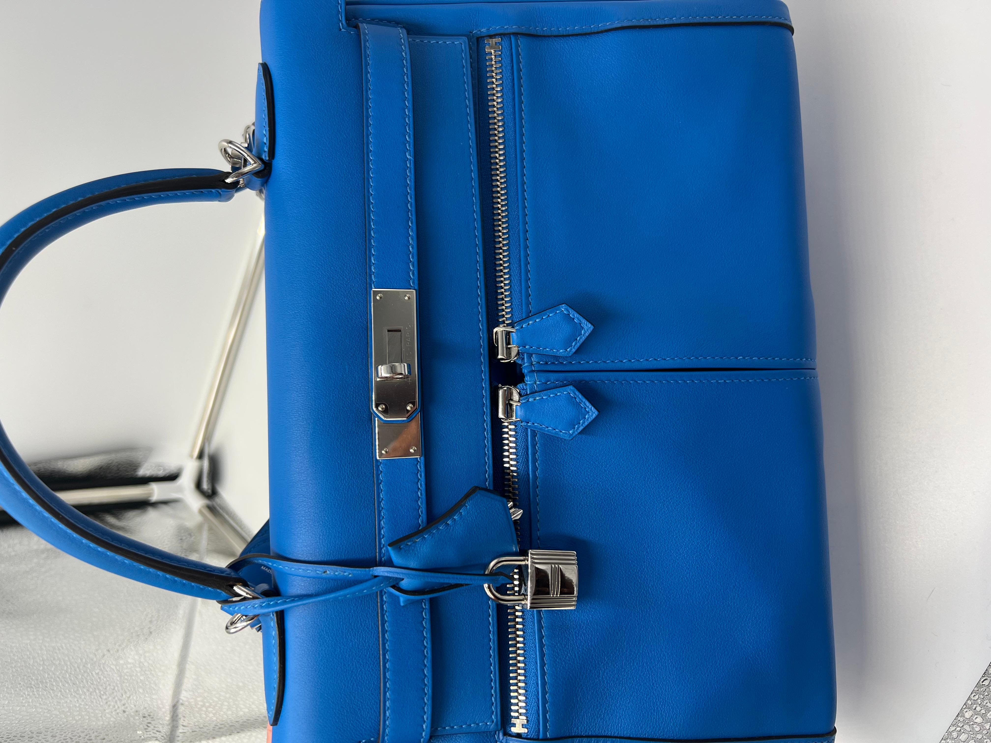 Hermes Kelly Lakis in the beautiful Blue Hydra colour with palladium hardware. This bag is a special order with the horseshoe sign.  A stamp. 
Front zippers and one back zipper.
Very very rare. 
In as new condition, stickers on most of the hardware.