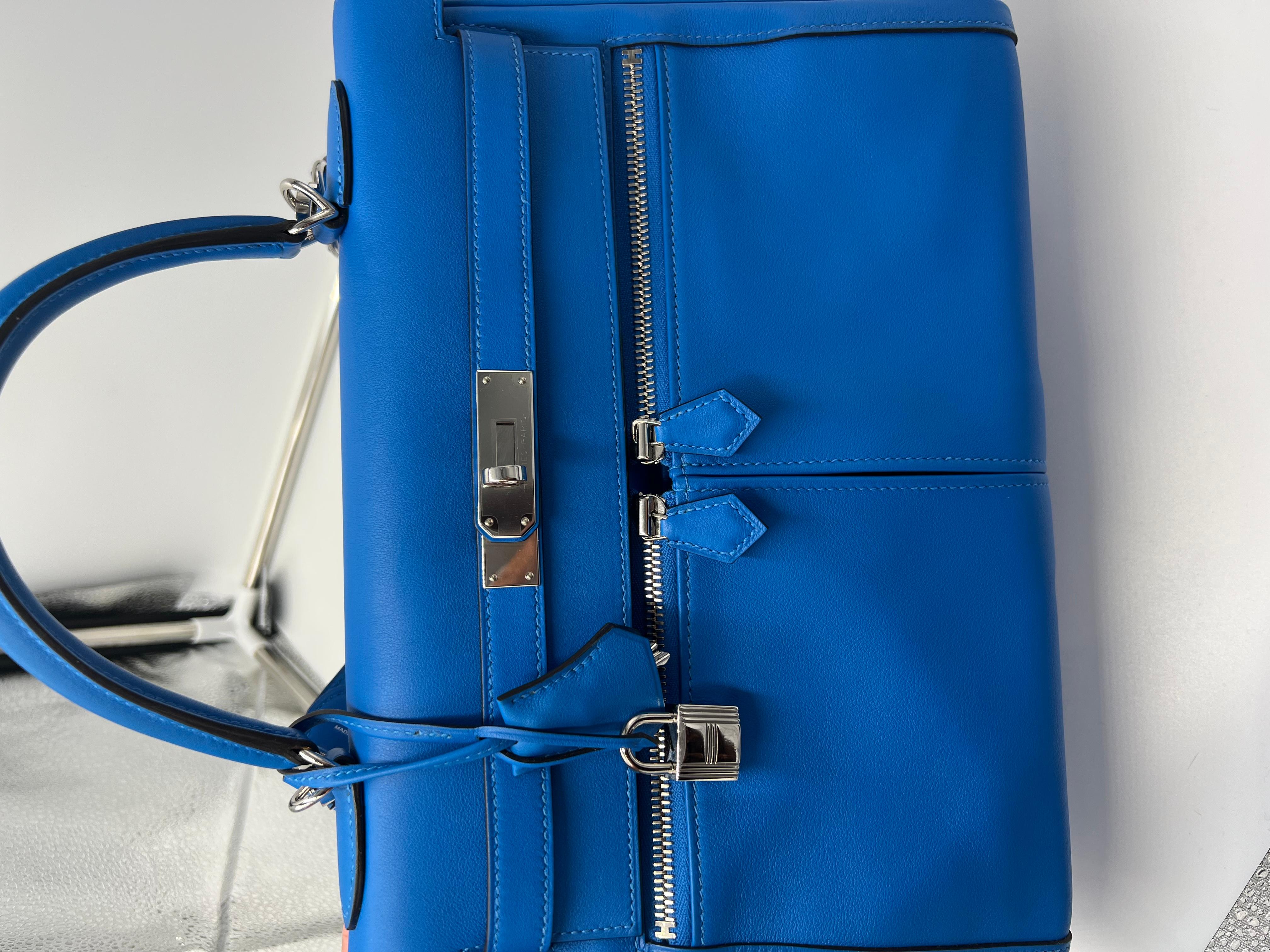 Hermes Kelly Lakis in the beautiful Blue Hydra colour with palladium hardware. This bag is a special order with the horseshoe sign.  A stamp. 
Front zippers and one back zipper.
Very very rare. 
In as new condition, stickers on most of the hardware.