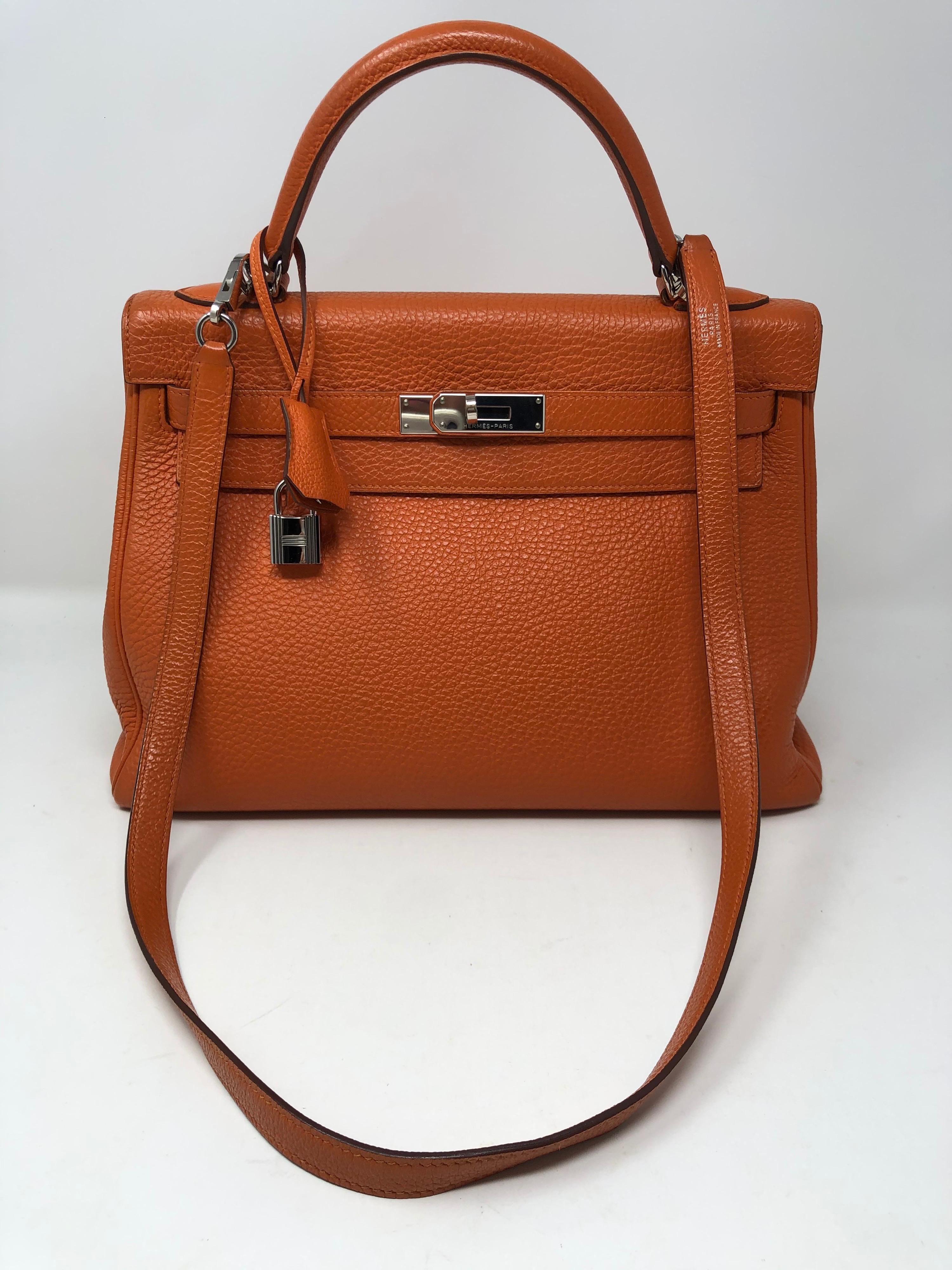 Hermes Kelly 32 Orange Bag. Palladium hardware. Excellent condition. Most wanted size 32 Kelly. Full set. Includes clochette. lock, keys, dust cover and box. Guaranteed authentic. 