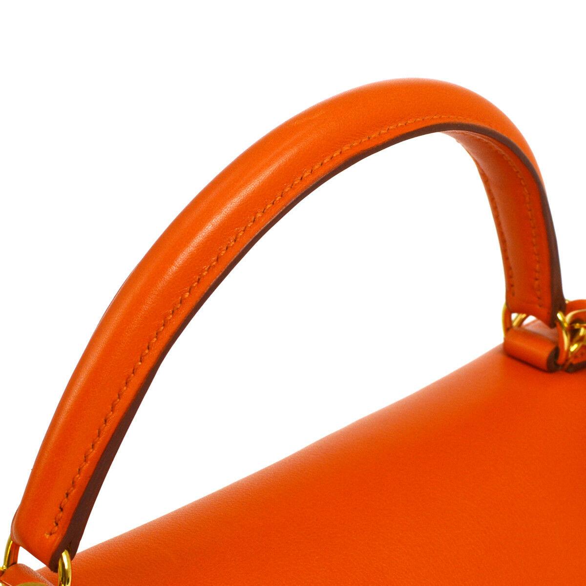 Hermes Kelly 32 Orange Leather Gold Top Handle Satchel Evening Kelly Bag

Leather
Gold tone hardware
Leather lining
Date code present
Made in France
Top Handle 3