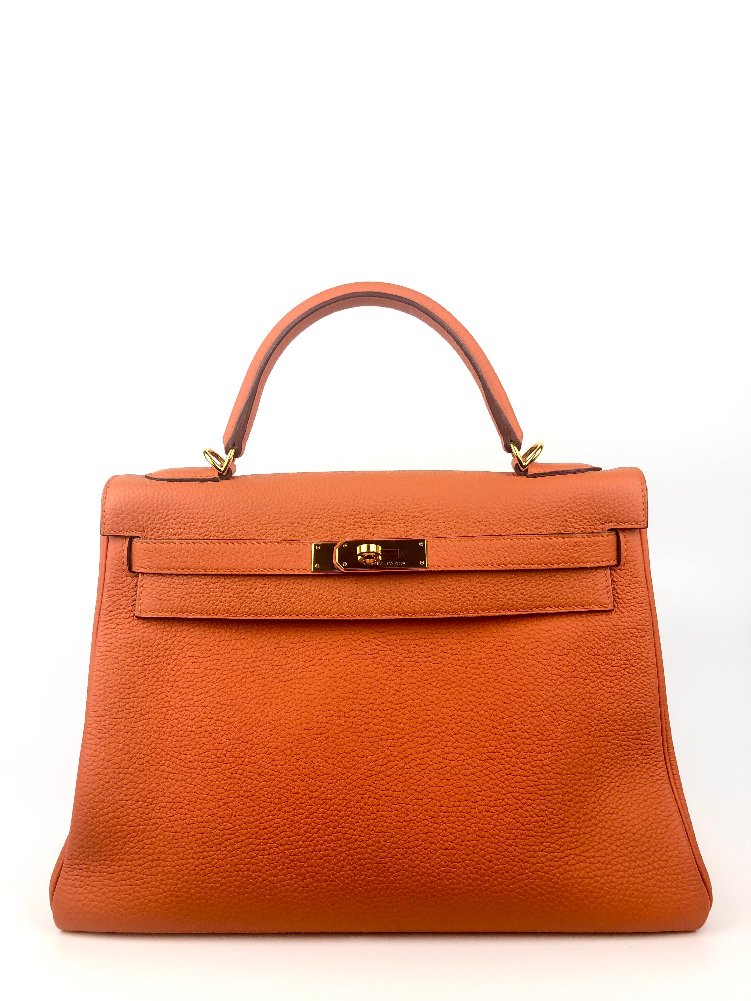 Hermes Kelly 32 Orange Togo GoldHardware. Excellent Condition, light hairlines on the hardware Plastic still on back plate hardware. Q stamp 2013.

Shop with confidence from Lux Addicts. Authenticity guaranteed! 