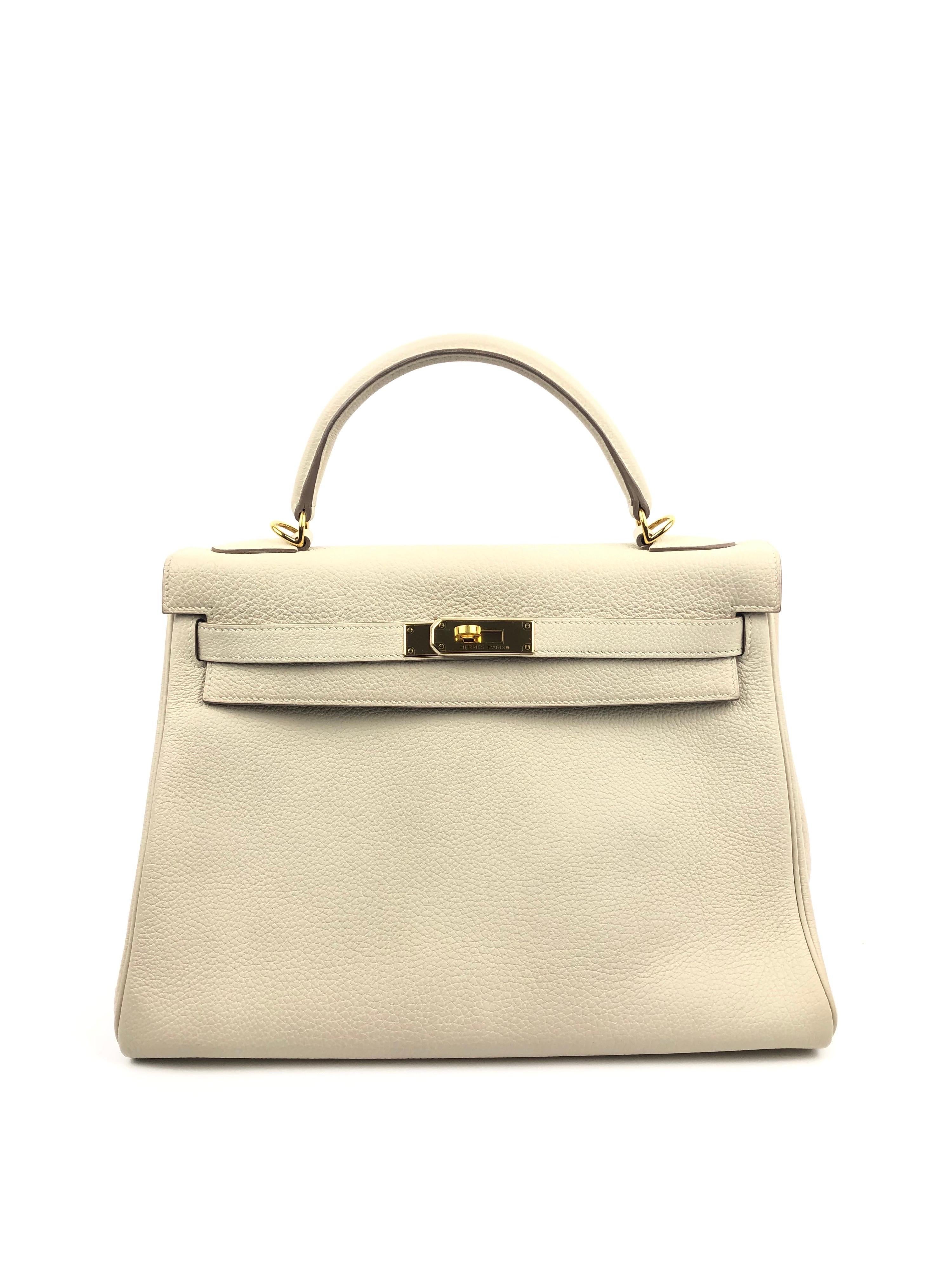 Hermes Kelly 32 Parchemin Beige Togo Gold Hardware. Pristine condition Plastic On Hardware.

Shop with confidence from Lux Addicts. Authenticity guaranteed or money back.