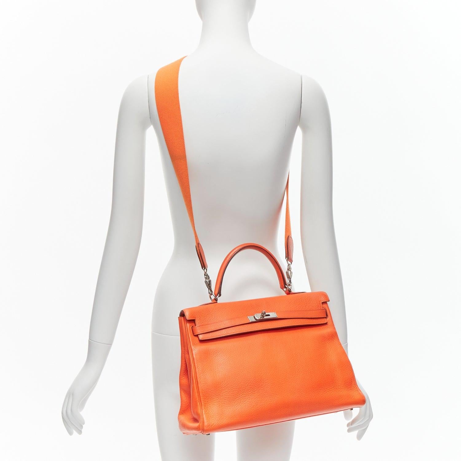 HERMES Kelly 32 PHW orange togo leather silver buckle top handle shoulder bag
Reference: GIYG/A00310
Brand: Hermes
Model: Kelly 32
Material: Leather
Color: Orange, Silver
Pattern: Solid
Closure: Turnlock
Lining: Orange Leather
Extra Details: With