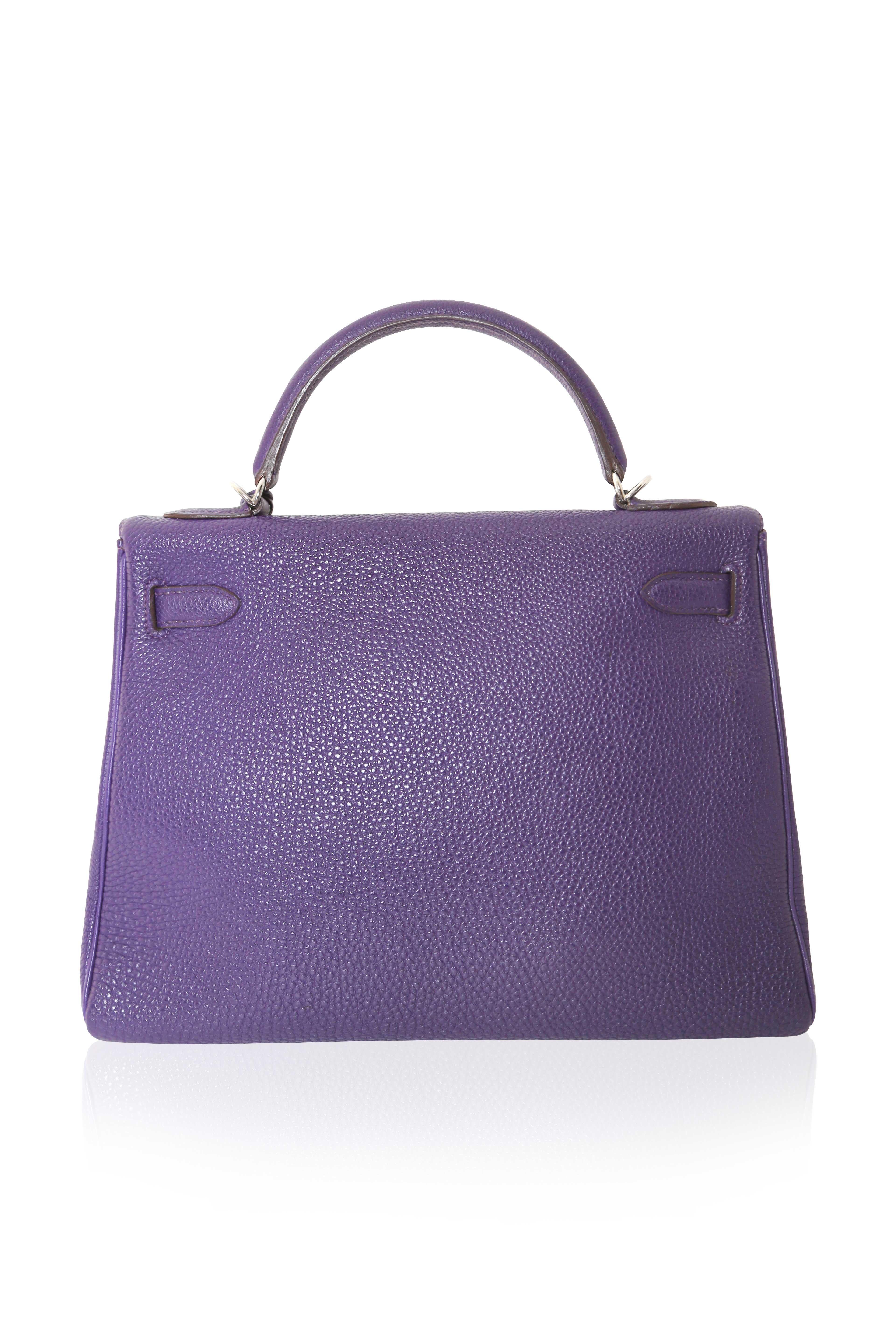Elevate your wardrobe with this classic PHW Kelly bag by Hermès. Crafted with Togo leather, this exquisite piece features palladium hardware, was crafted in 2010 and has been kept in excellent condition. Enhance your style today with this timeless