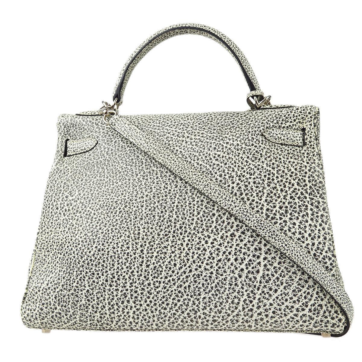 Hermes Kelly 32 Retourne 2way Shoulder Handbag Buffalo Skipper Dalmatian

Additional information:
Color / Material : Dalmatian / Buffalo Skipper
Pocket : Inside: Zipper Pocket x1, Pocket x2
Size(Inch) : W 12.6 x H 9.1 x D 4.7 