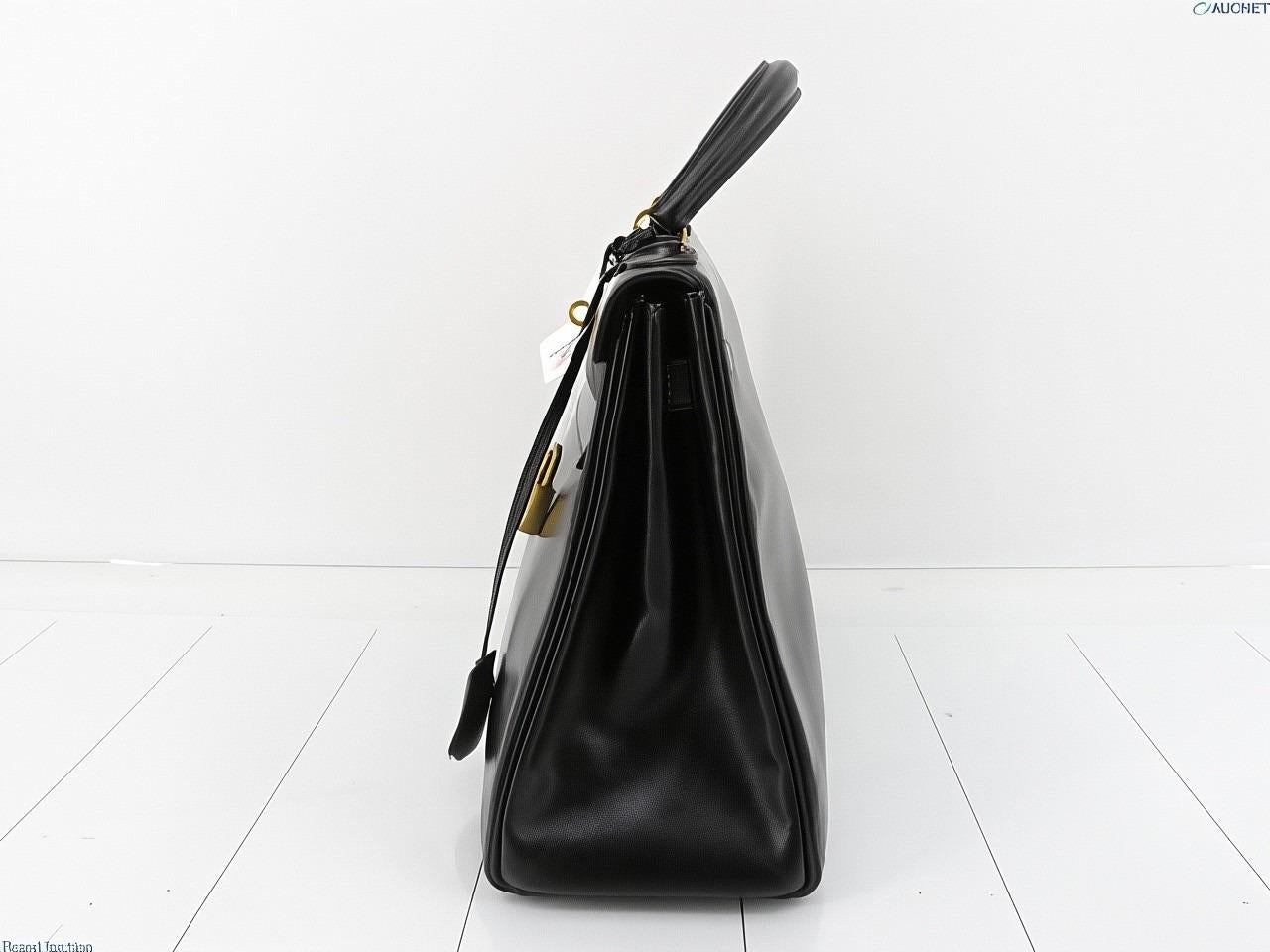 Hermes Kelly 32 Retourne Caja Negra Piel Oro HW 1987 en Bueno estado para la venta en AUBERVILLIERS, FR
