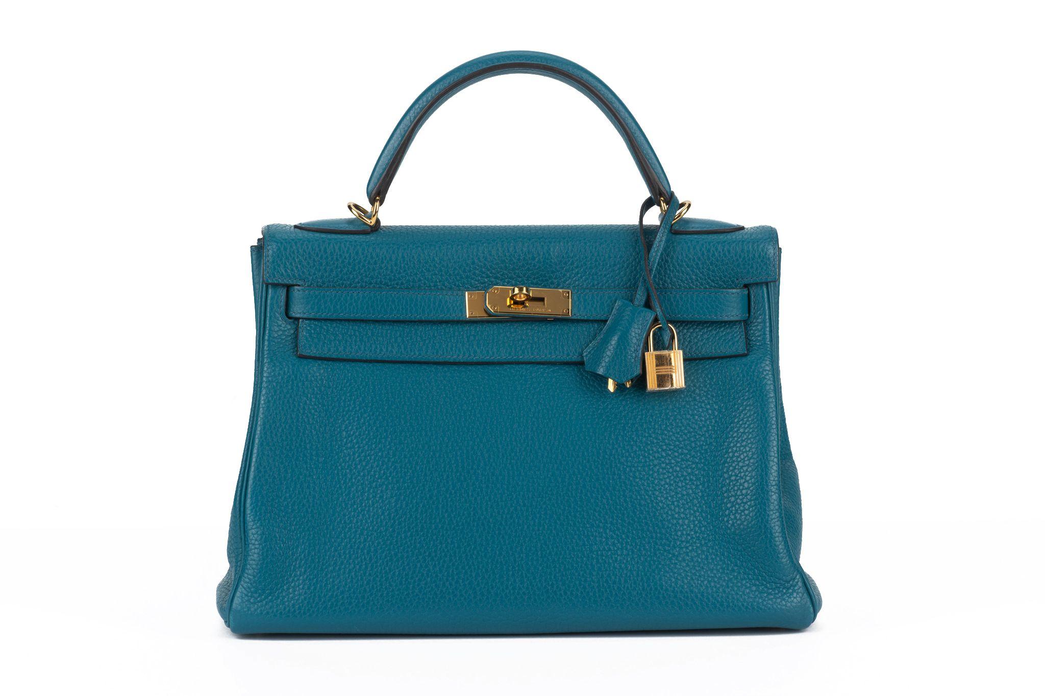 Hermès kelly retournè 32cm taurillon clemence blue Izmir with gold tone hardware. Handle drop 3.5
