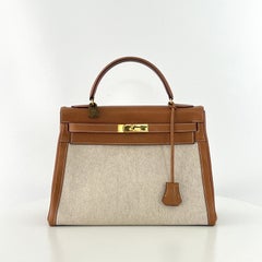 HERMÈS Kelly 32 Retourne Gold Courchevel Leather and Beige Canvas 1986