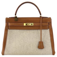 HERMÈS Kelly 32 Retourne Gold Courchevel Leather and Beige Canvas 1986