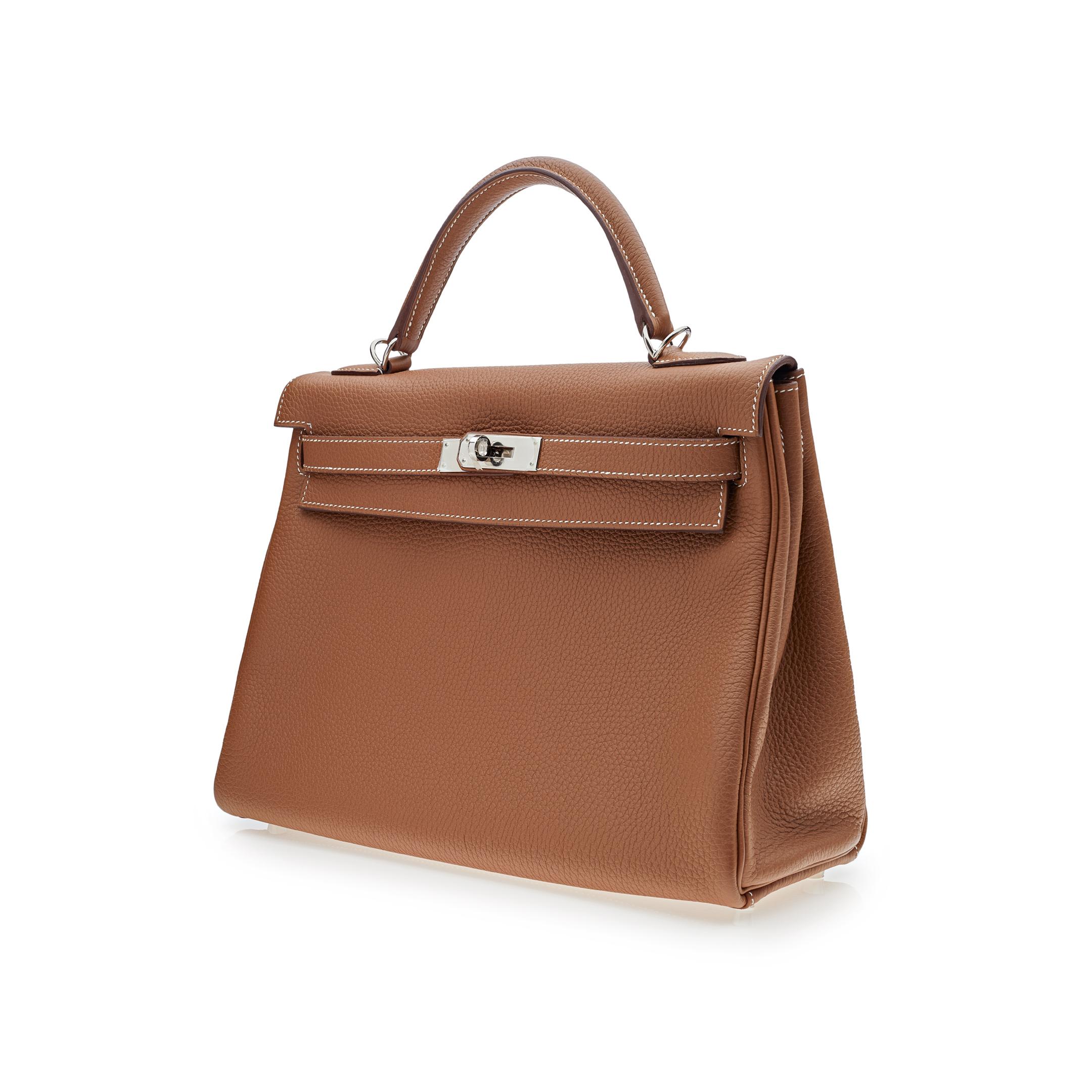 Hermes Kelly 32 Retourne Gold Togo Leather Palladium Hardware

Condition: New
Material: Togo Leather
Measurements: 32cm (w) x 23cm (h) x 10.5cm (d)
Hardware: Palladium plated

*Comes with full original packaging.
*Full plastic on hardware.