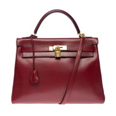 Hermès Kelly 32 retourne handbag strap in Burgundy box calfskin leather, GHW