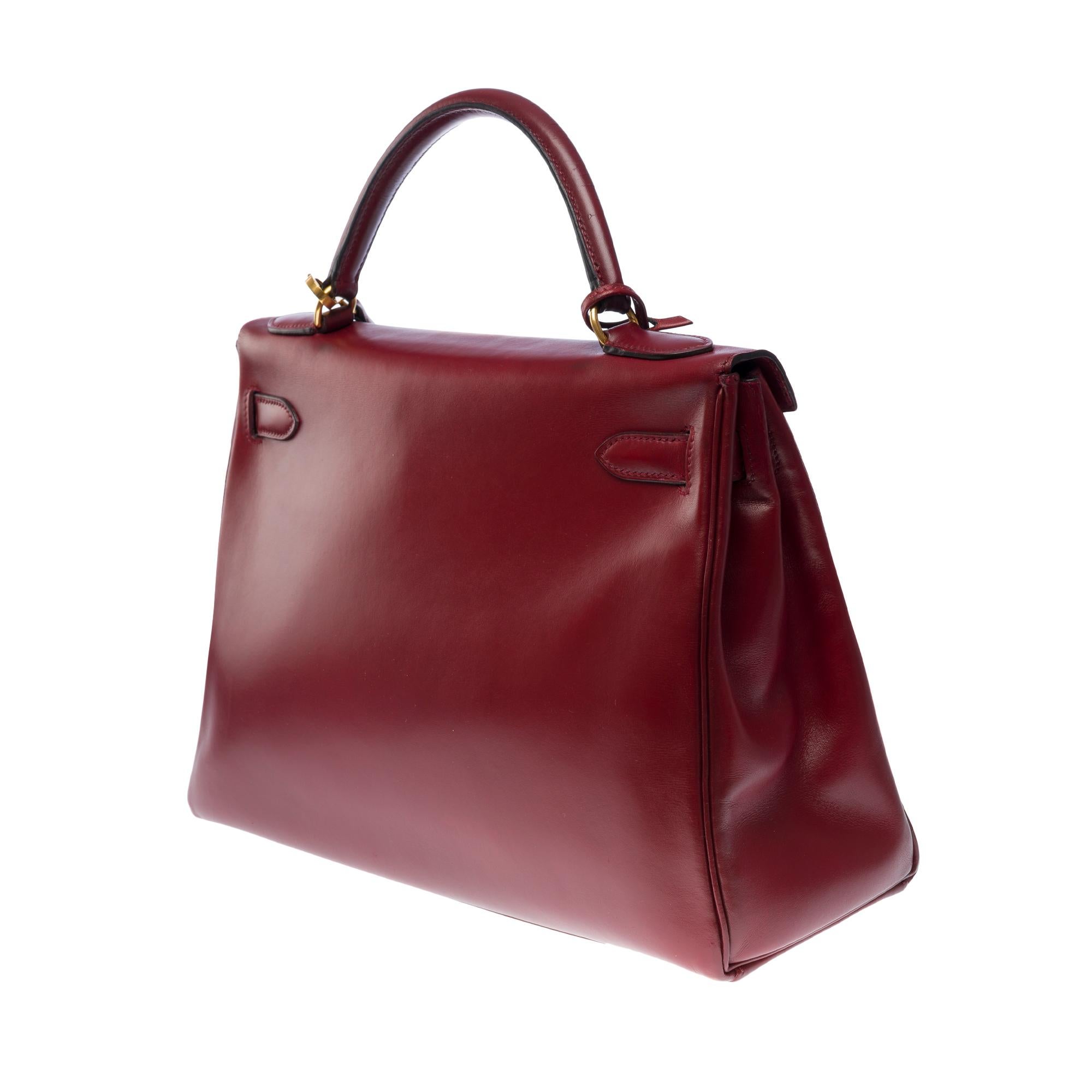 Hermès Kelly 32 retourne handbag strap in Burgundy box calfskin leather, GHW 1