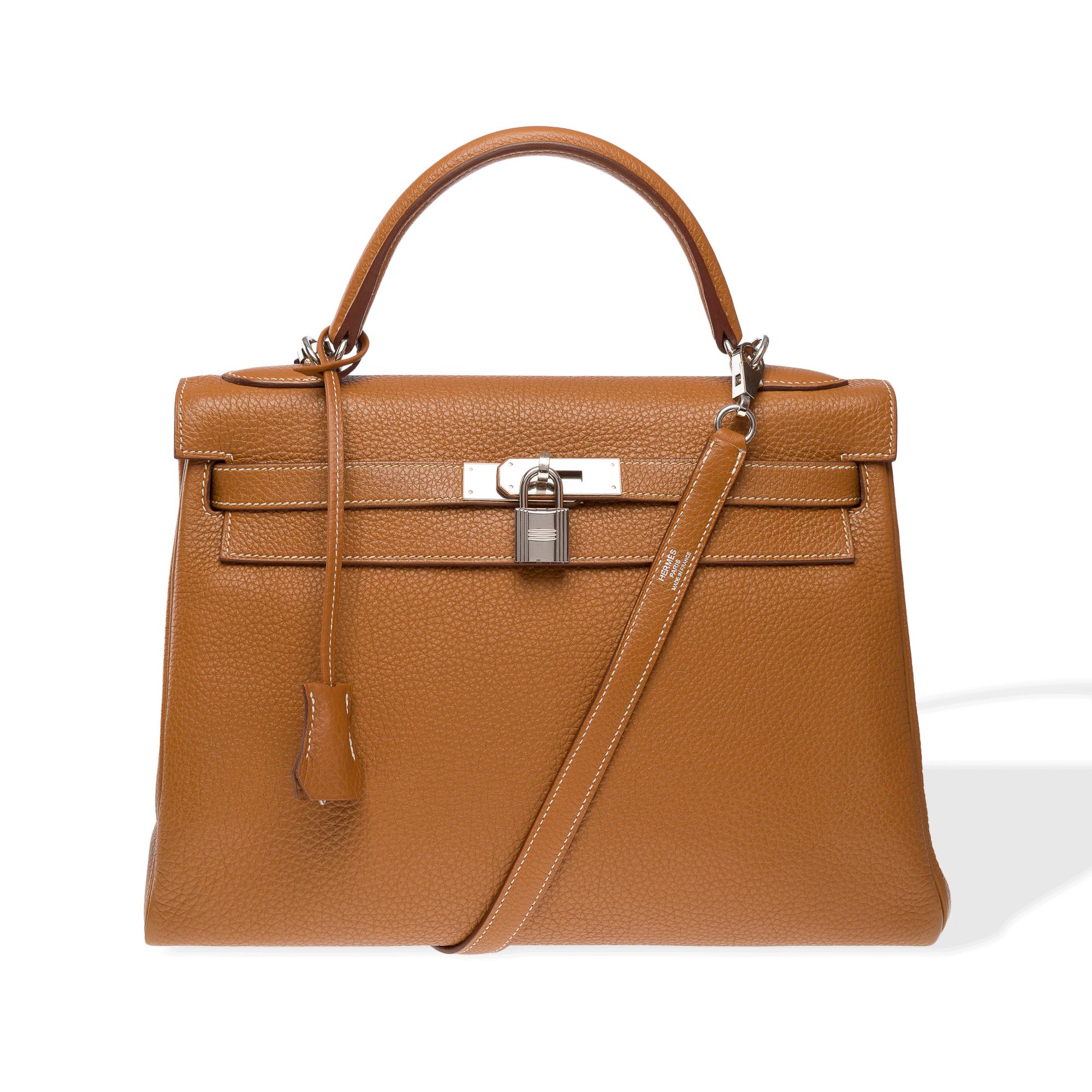 Beautiful​ ​Hermes​ ​Kelly​ ​32​ ​retourné​ ​handbag​ ​strap​ ​in​ ​Camel​ ​(Gold)​ ​Togo​ ​calf​ ​leather,​ ​with​ ​silver​ ​palladium​ ​metal​ ​trim,​ ​camel​ ​leather​ ​handle,​ ​and​ ​removable​ ​camel​ ​leather​ ​shoulder​ ​strap​ ​allowing​