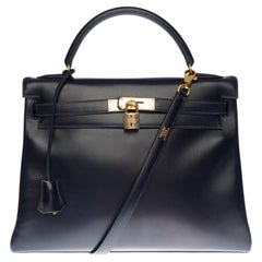 Hermès Kelly 32 retourné handbag with strap in Navy blue calf leather, GHW