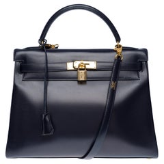 Hermès Kelly 32 retourné handbag strap in Navy blue calf leather, GHW
