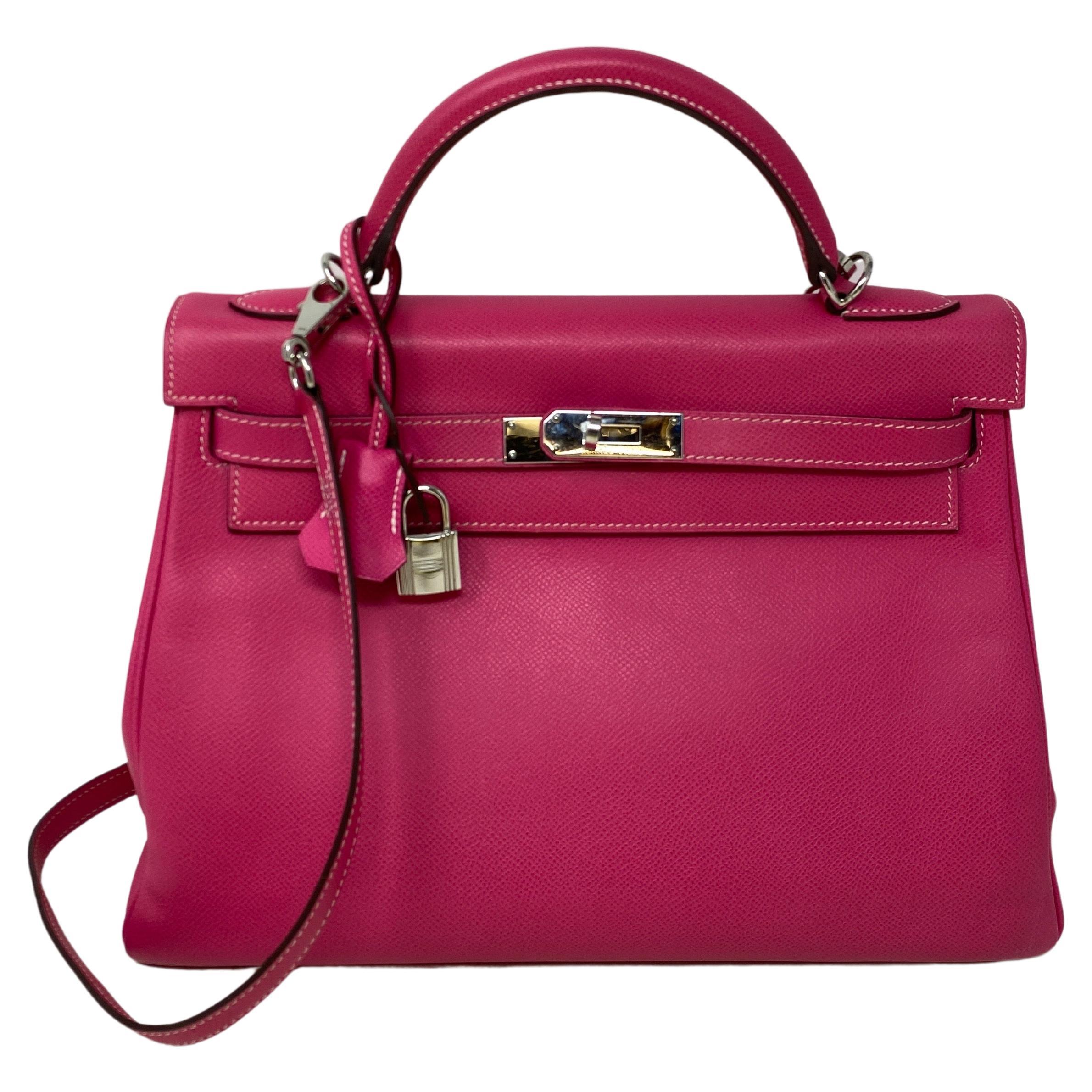 Hermes Kelly 32 Rose Tyrien Bag. Excellent like new condition. Bright hot pink color epsom leather. Palladium silver hardware. Candy collection. Interior is rubis red and exterior rose tyrien color. Clean interior. Includes clochette, lock, keys,