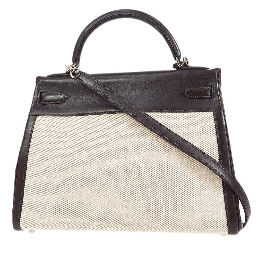 Pre-Owned Vintage Condition
From 2003 Collection
Toile 
Box Calfskin Leather
Palladium Hardware
Leather Lining
Measures 12.5