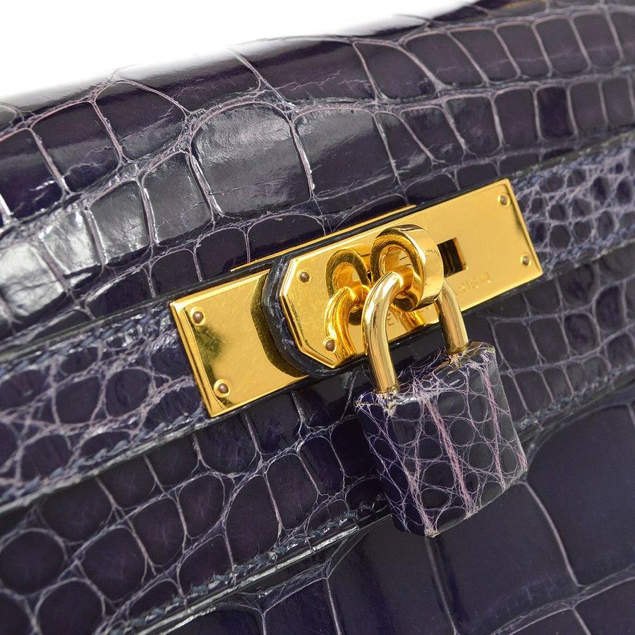 Pre-Owned Vintage Condition
From 1993 Collection
Alligator Crocodile 
Gold Tone Hardware
Leather Lining
Measures 13