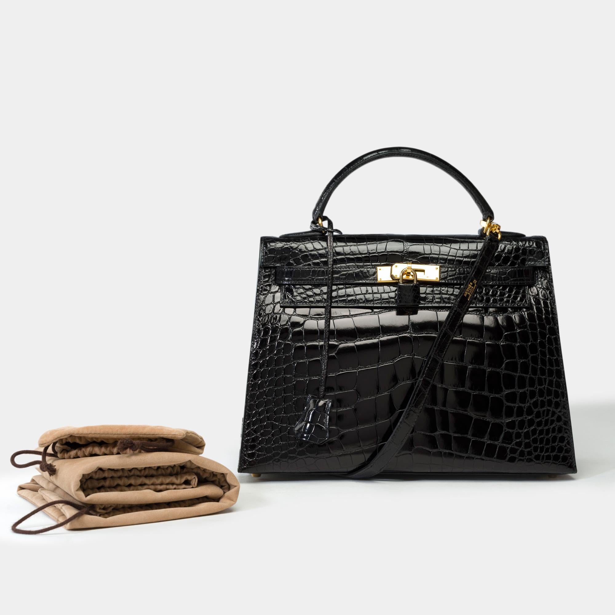 Amazing​ ​&​ ​Rare​ ​Hermès​ ​Kelly​ ​32​ ​handbag​ ​strap​ ​in​ ​Black​ ​Alligator​ ​Mississippiensis​ ​,​ ​removable​ ​shoulder​ ​strap​ ​in​ ​black​ ​alligator,​ ​fasteners​ ​and​ ​clasp​ ​in​ ​gold​ ​plated​ ​metal,​ ​handle​ ​in​ ​black​