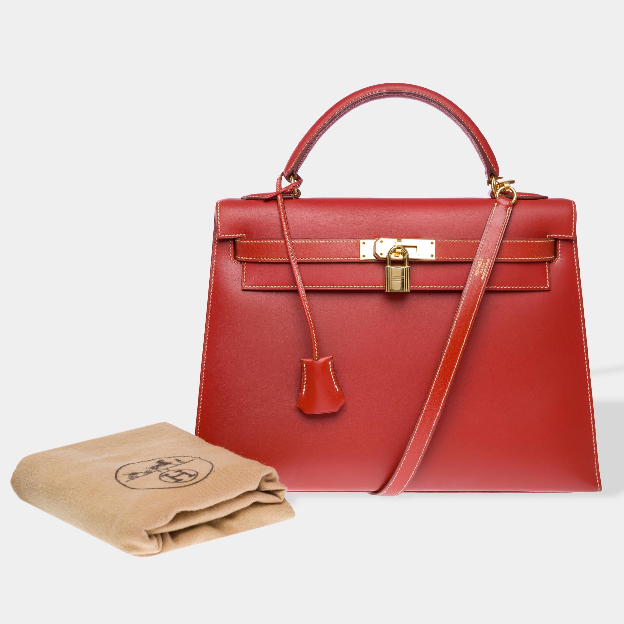 Exceptional & Rare Hermes Kelly 32 sellier handbag strap in red brick box calf leather with white stitching, gold metal hardware, removable red box calf shoulder strap, single red box calf handle for hand or shoulder carry

Flap closure
Red leather