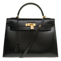 Hermès Kelly 32 sellier handbag with strap in black calf box and gold hardware
