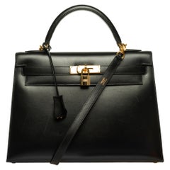 Hermès Kelly 32 sellier handbag with strap in black calf box and gold hardware