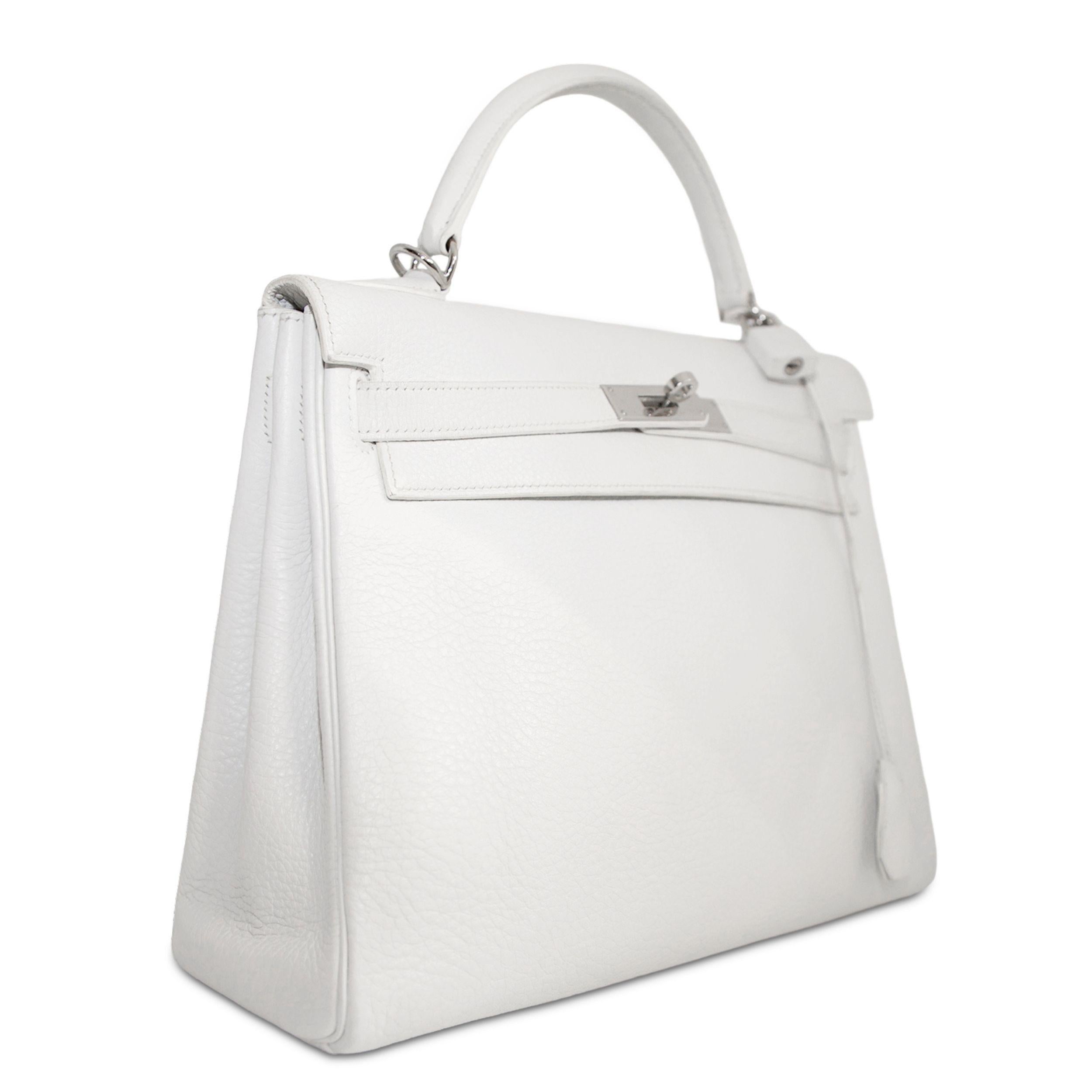 - Kelly 32
- White
- Togo leather, known for its texture and durability against scuffing and scratching
- Palladium hardware
- Turn-lock closure
- Detachable shoulder/crossbody strap
- Comes with strap, clochette, lock, and keys
- Stamp L Square,