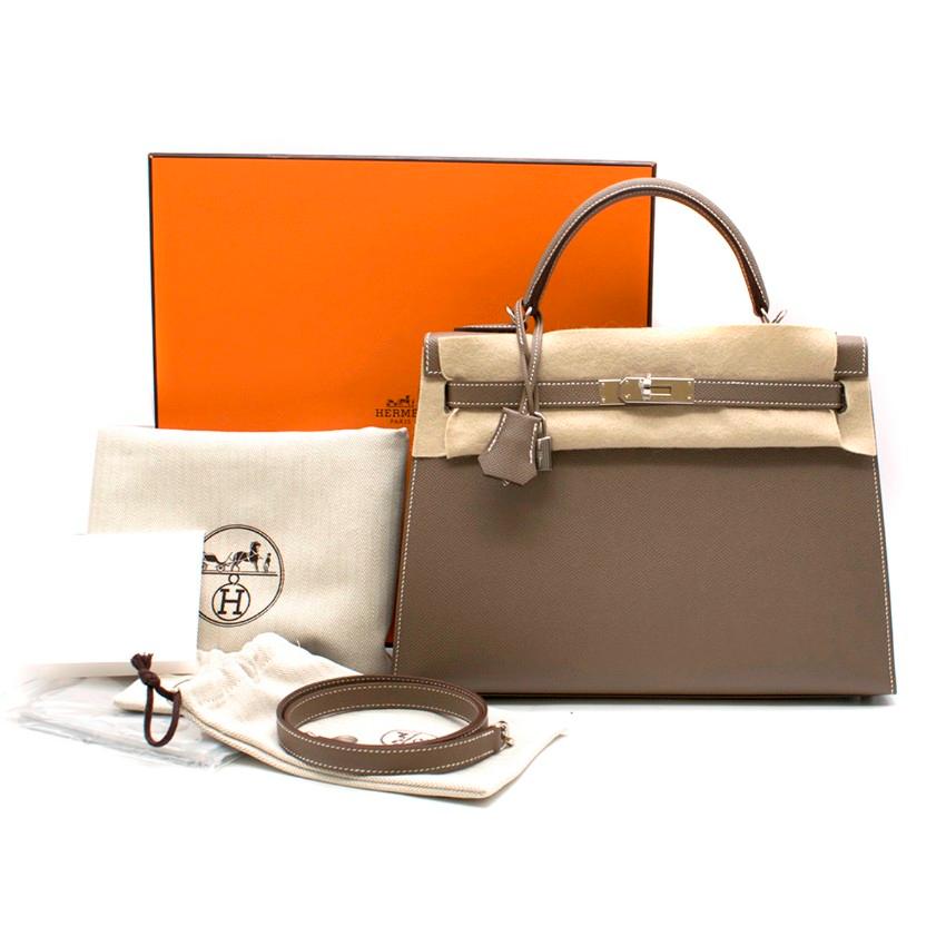 Hermes Kelly 32cm Etoupe Togo Leather Bag.

- Serial Number: C 
- Age (Circa): 2018
- Etoupe-brown, Togo leather 
- Top leather handle, detachable shoulder strap 
- Dark-brown lacquered edges, signature gold-plated hardware 
- Signature twist-lock