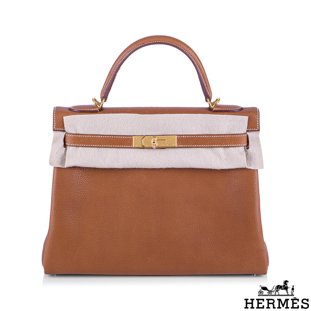 An exquisite and rare Hermés 32cm Kelly bag. The exterior of this Kelly features a Retourne style in rare Fauve Barenia Faubourg  leather. Fauve Barenia Faubourg is a new lightly grained version of the original Barenia leather by Hermés. The leather