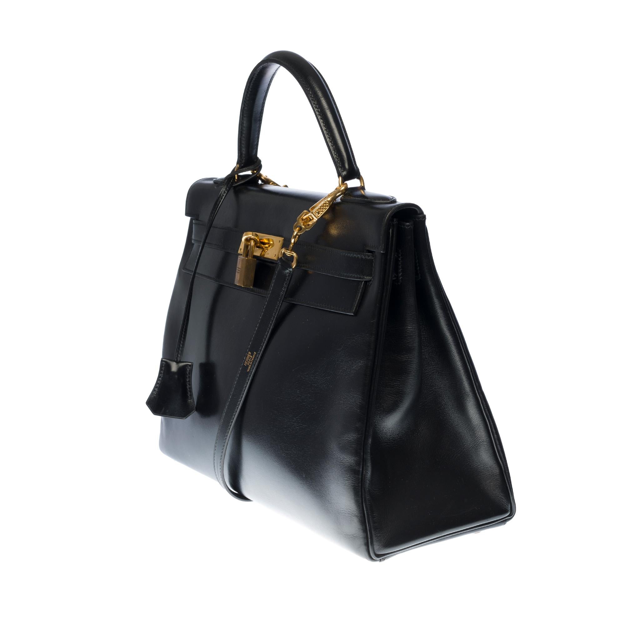 Black Hermès Kelly 32cm handbag with strap in black calf leather and gold hardware