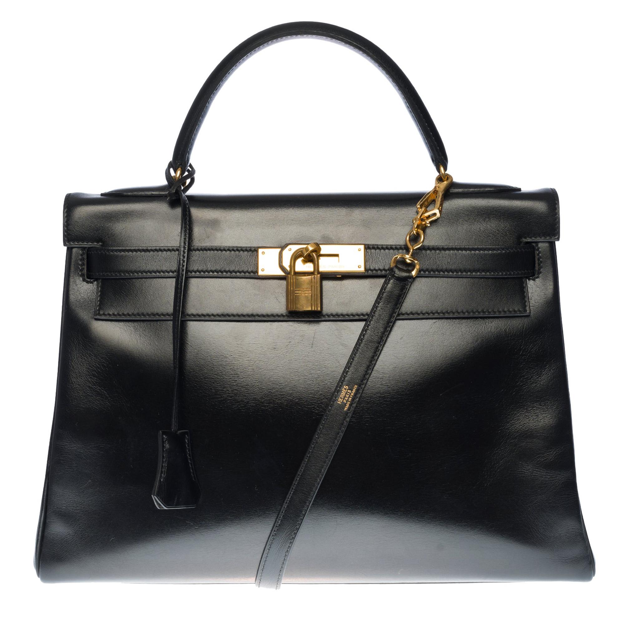 Hermès Kelly 32cm handbag with strap in black calf leather and gold hardware