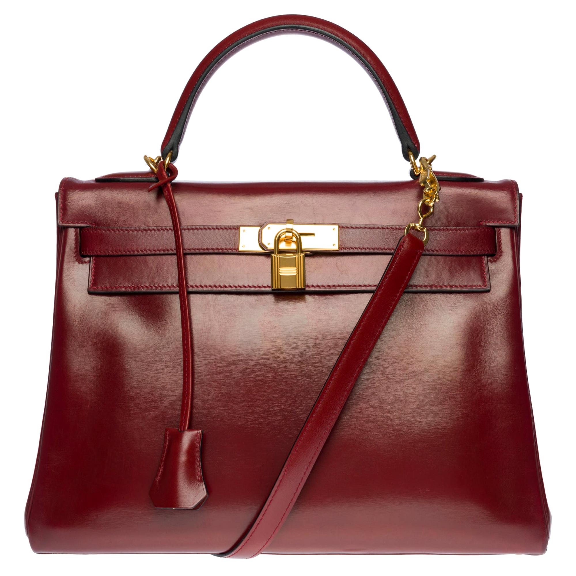 Hermès Kelly 32cm handbag with strap in burgundy calf leather and GHW