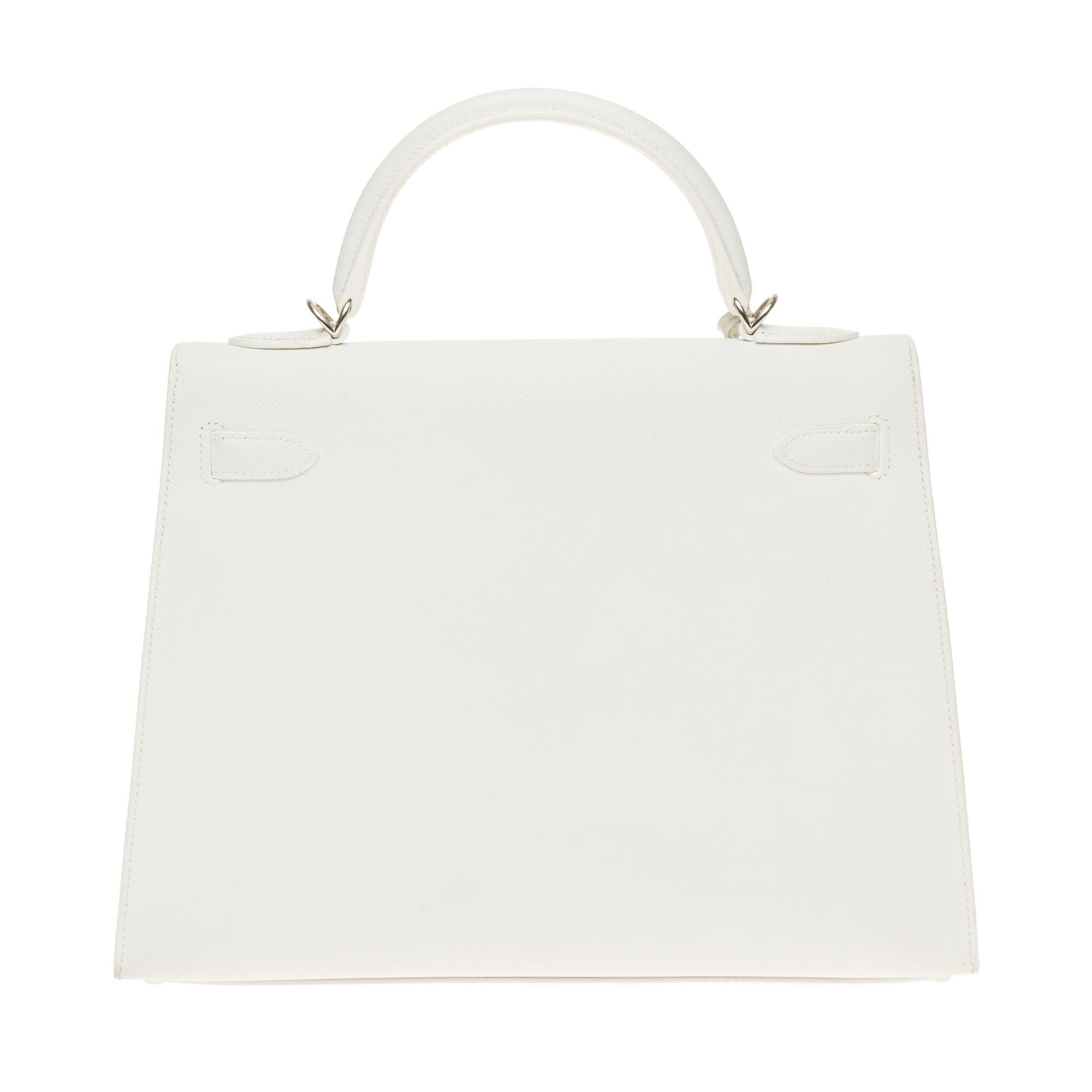 Hermes Kelly Handbag 32 cm in Epsom White leather, Palladium metal trim, white saddle stitches, simple white leather handle, removable white leather shoulder strap handle for carrying hand or shoulder

Closure by flap
White leather inner lining, one