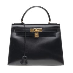 Hermès Kelly 32cm sellier handbag with strap in black calfskin, gold hardware!