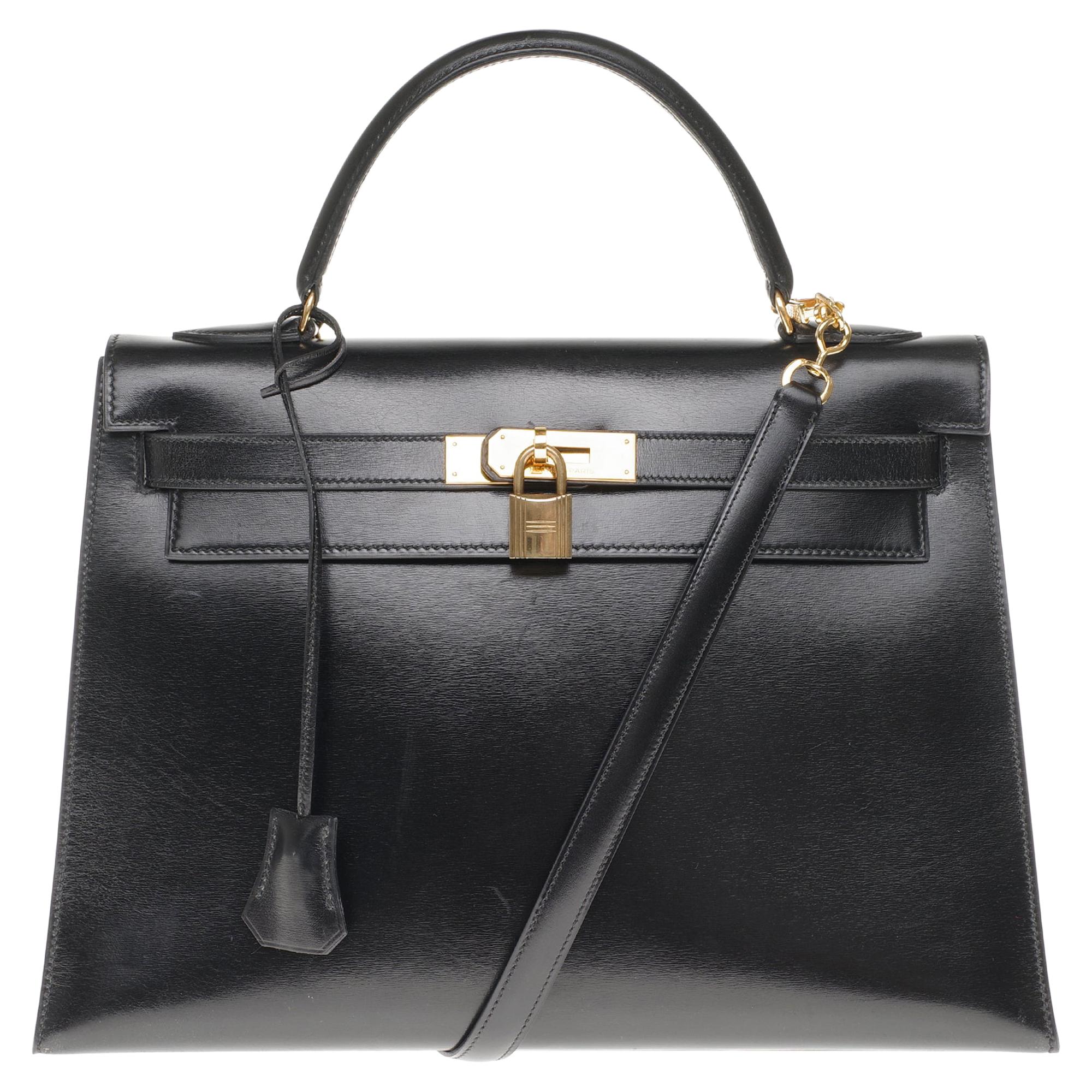 Hermès Kelly 32cm sellier handbag with strap in black calfskin, gold hardware!