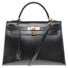 Hermès Kelly 32cm sellier handbag with strap in black calfskin, gold hardware!