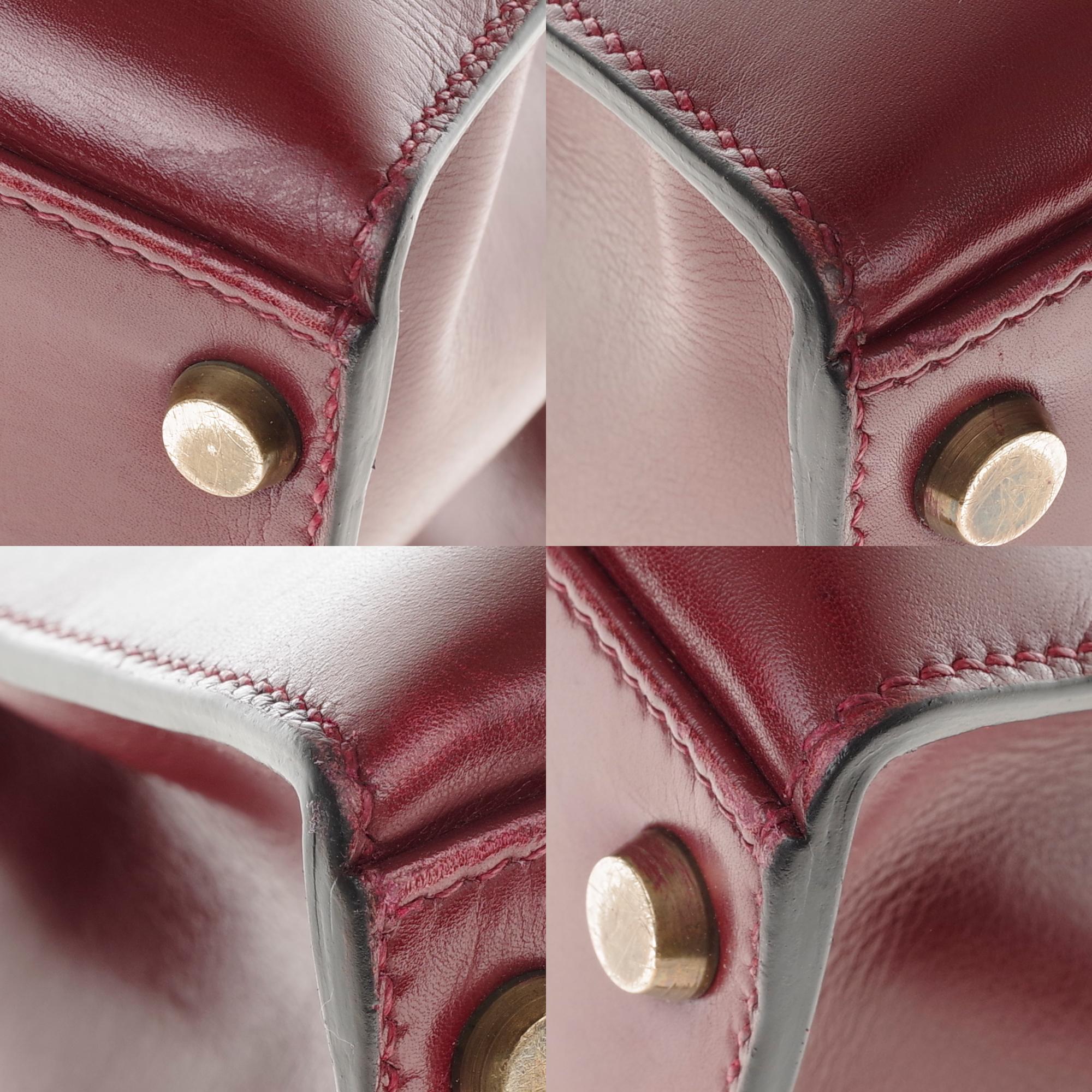 Hermès Kelly 32cm sellier handbag with strap in burgundy calfskin, gold hardware 6