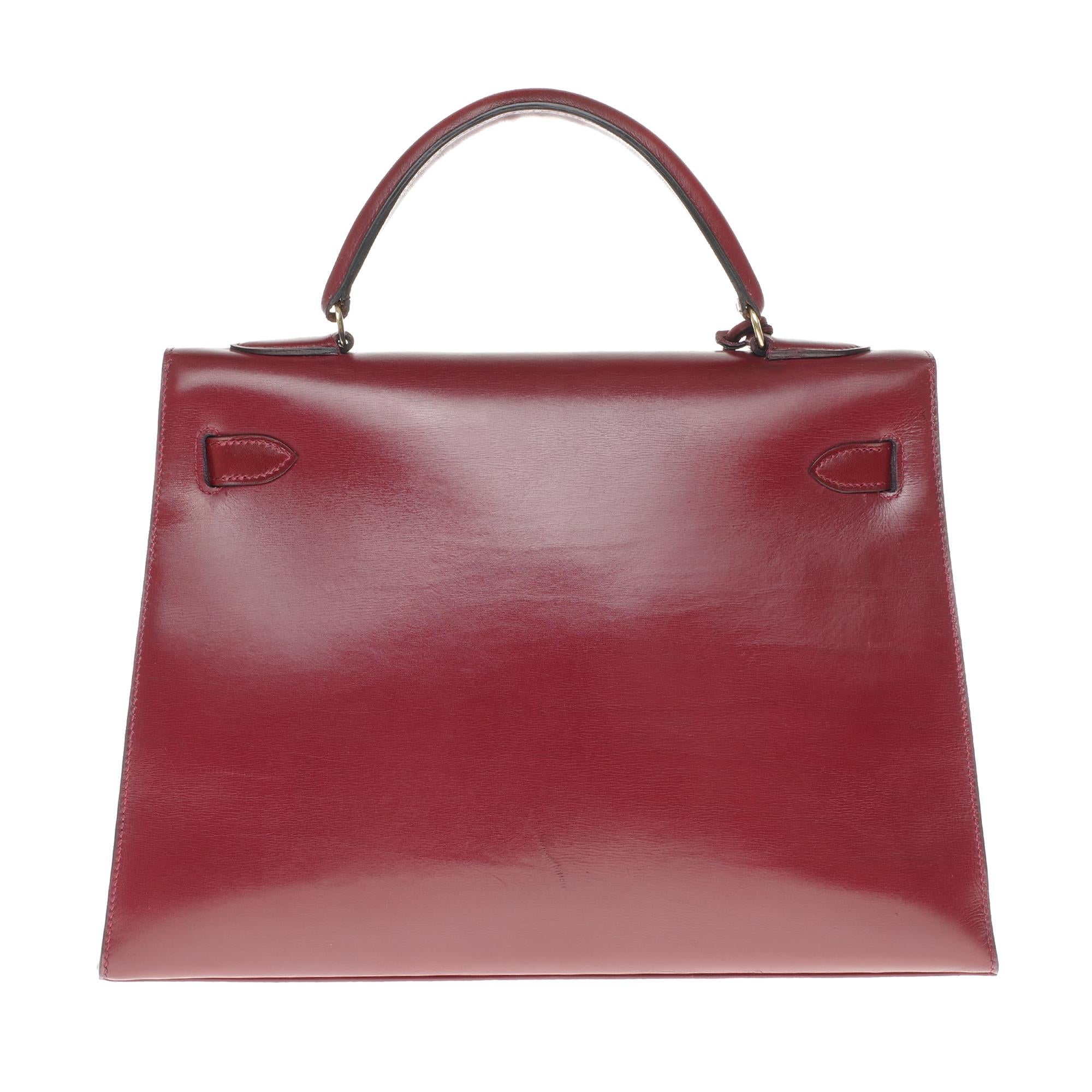Brown Hermès Kelly 32cm sellier handbag with strap in burgundy calfskin, gold hardware