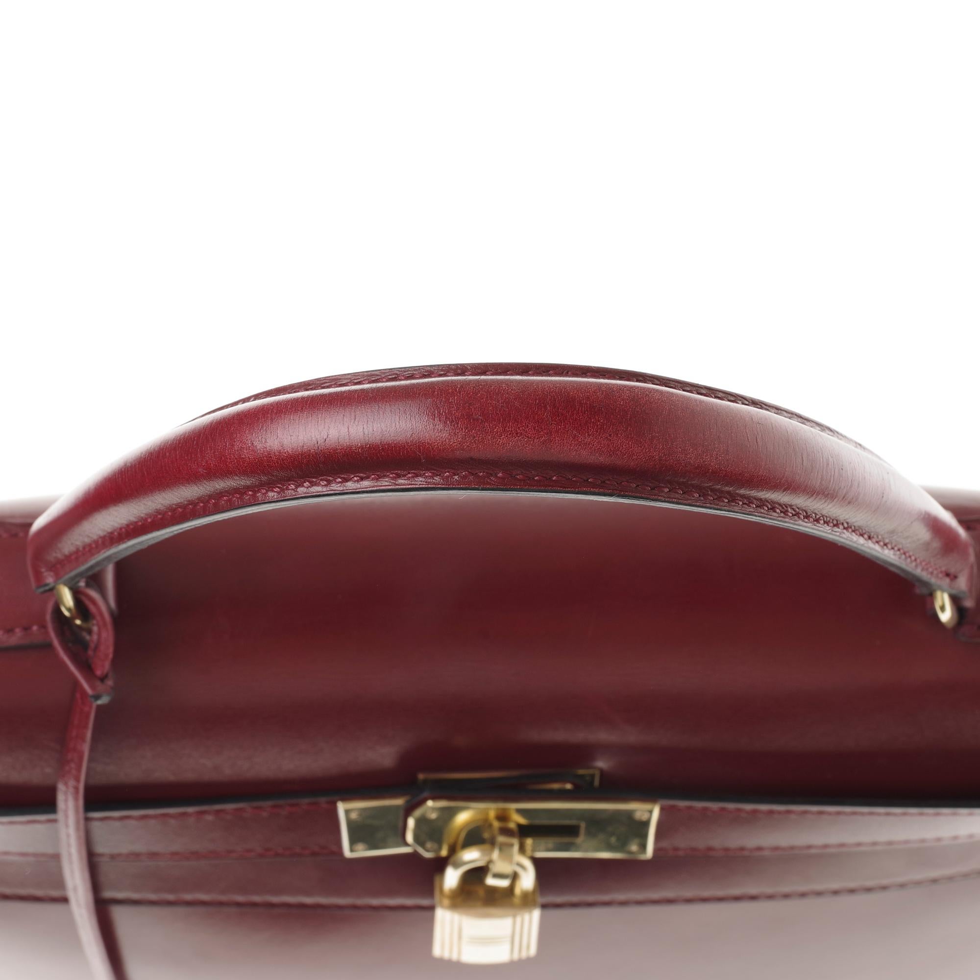 Hermès Kelly 32cm sellier handbag with strap in burgundy calfskin, gold hardware 4