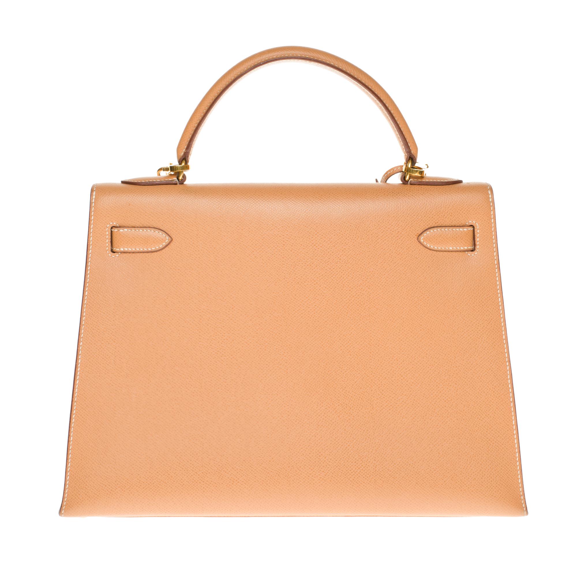 Gorgeous Hermes Kelly sellier 32 cm handbag in Courchevel Gold leather, gold-plated metal trim, single handle in gold courchevel leather, a removable shoulder strap allowing a hand or shoulder support.
Closure by flap.
Gold leather inner lining, one