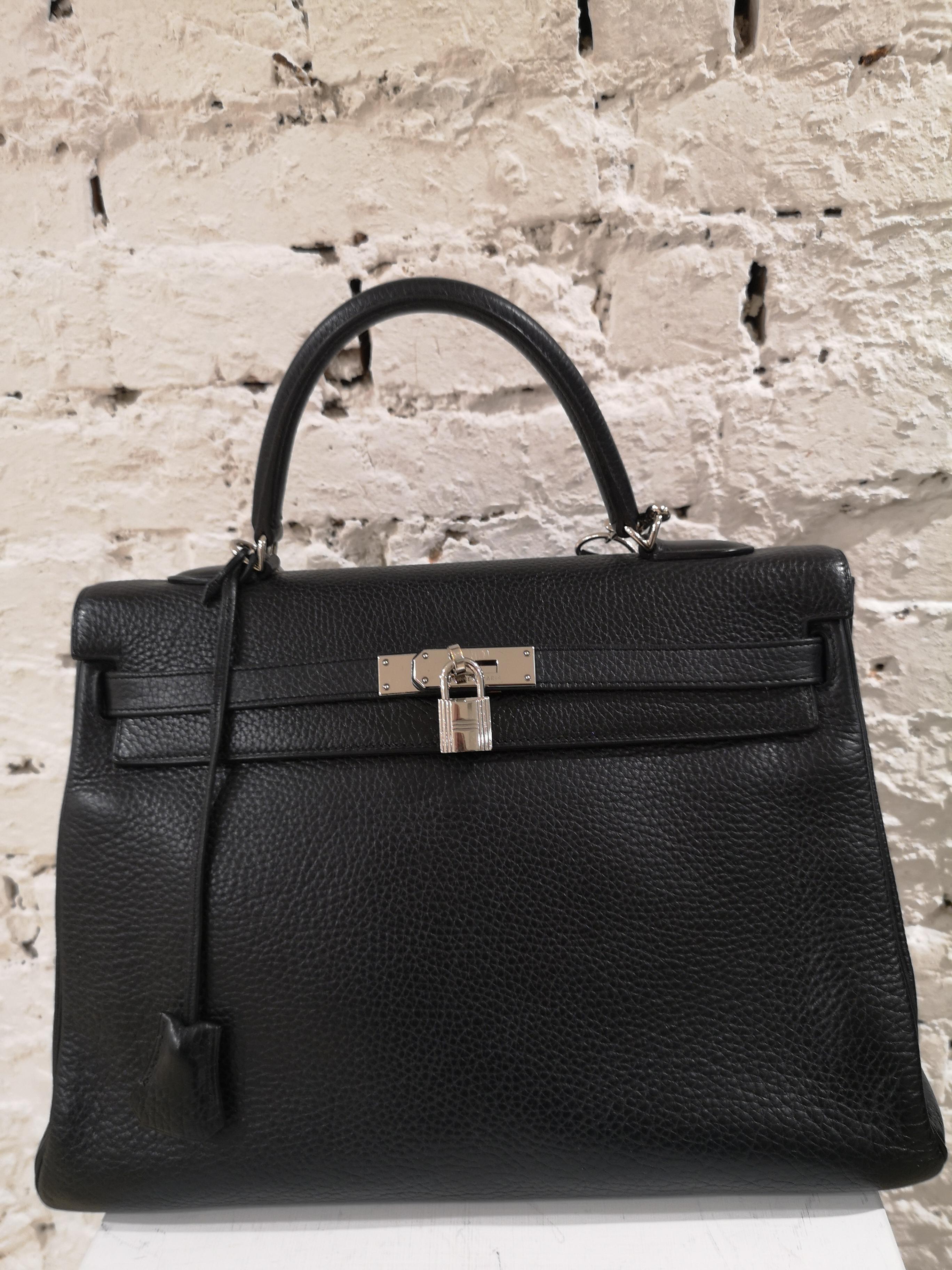 Hermès Kelly 35 black leather
shoulder strap and dust bag inside