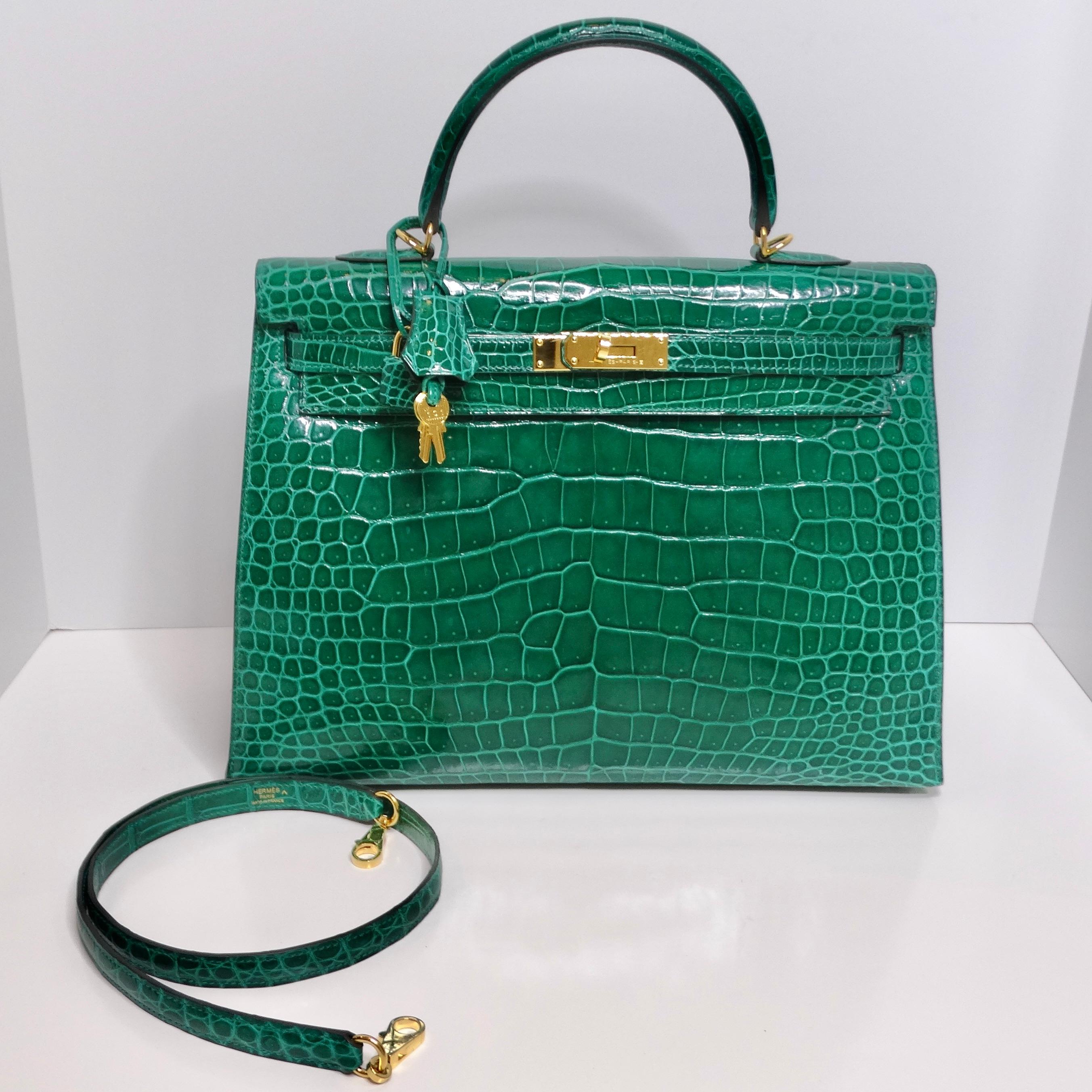 Introducing the epitome of luxury and sophistication, the Hermes Kelly 35 Malachite Shiny Crocodile Porosus Gold Hardware handbag. Crafted in 2018, this iconic handbag is a testament to Hermes' impeccable craftsmanship and timeless design.

This